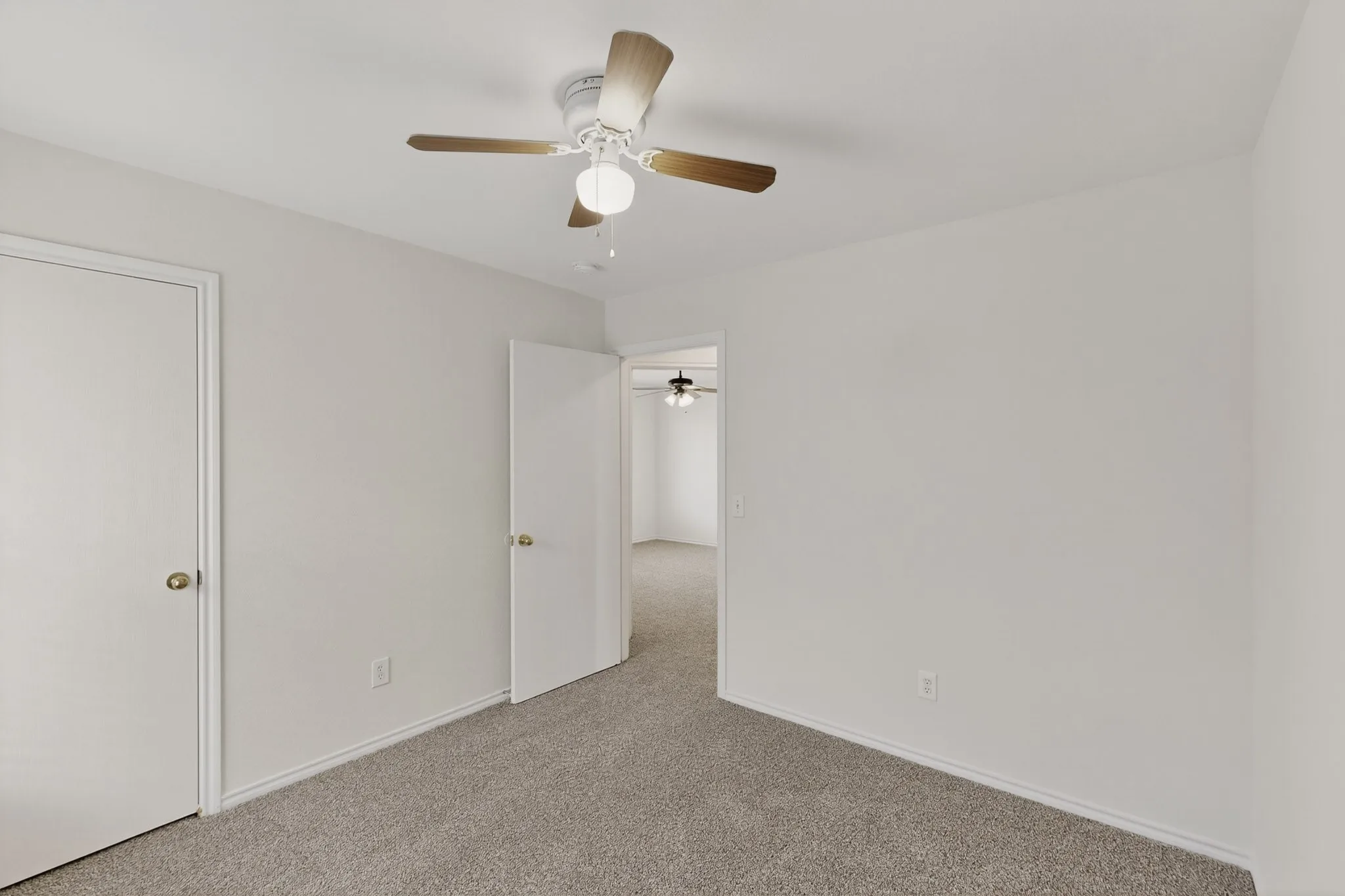 Textured carpeting and neutral wall tones