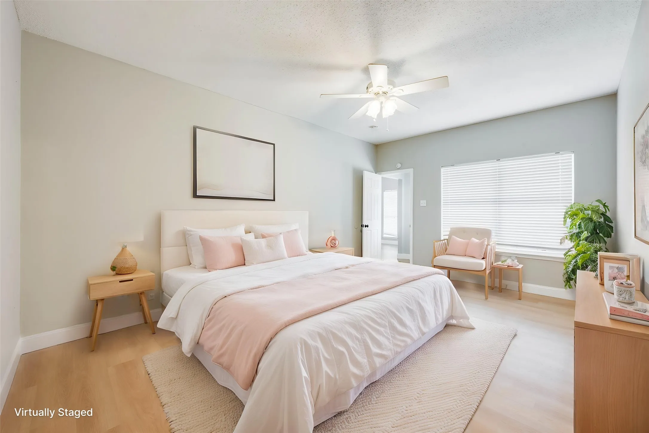 Wood-finish flooring, ceiling fan with integrated lighting, and window with blinds
