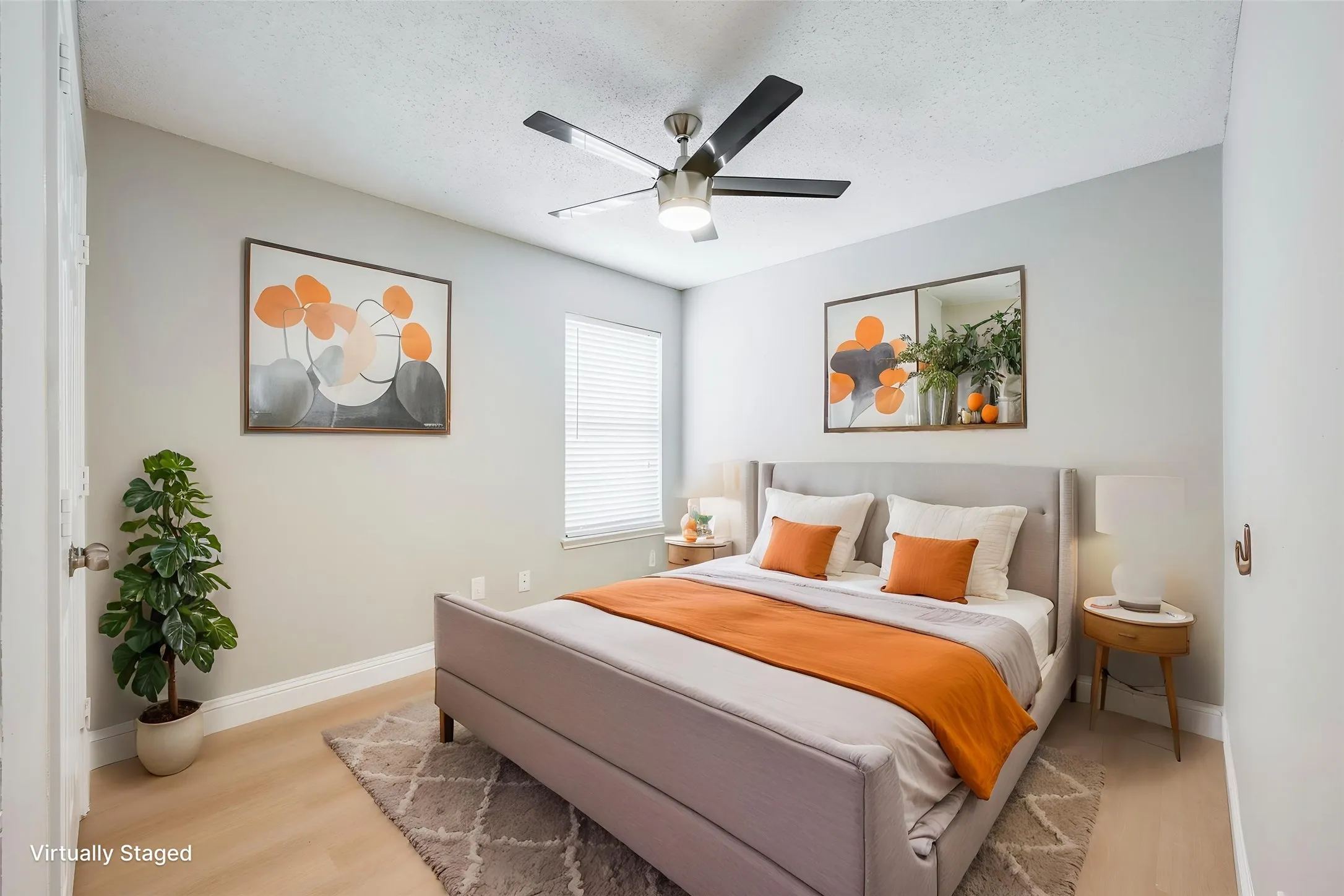 Wood-finish flooring, neutral wall tones, window with horizontal blinds, and a ceiling fan with light fixture