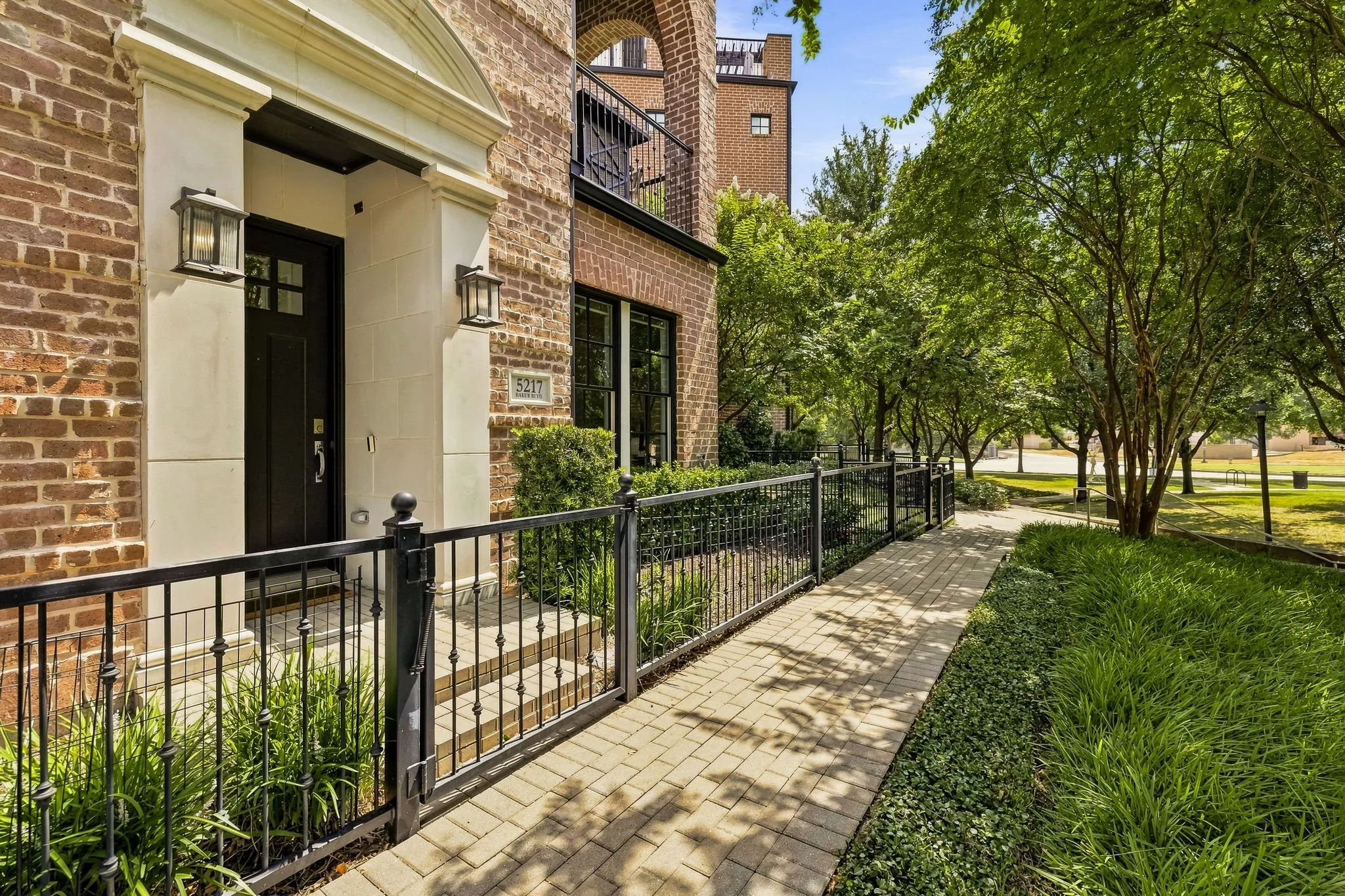 Front of unit faces luscious landscaping, Lake Carolyn, and Opitz Park.