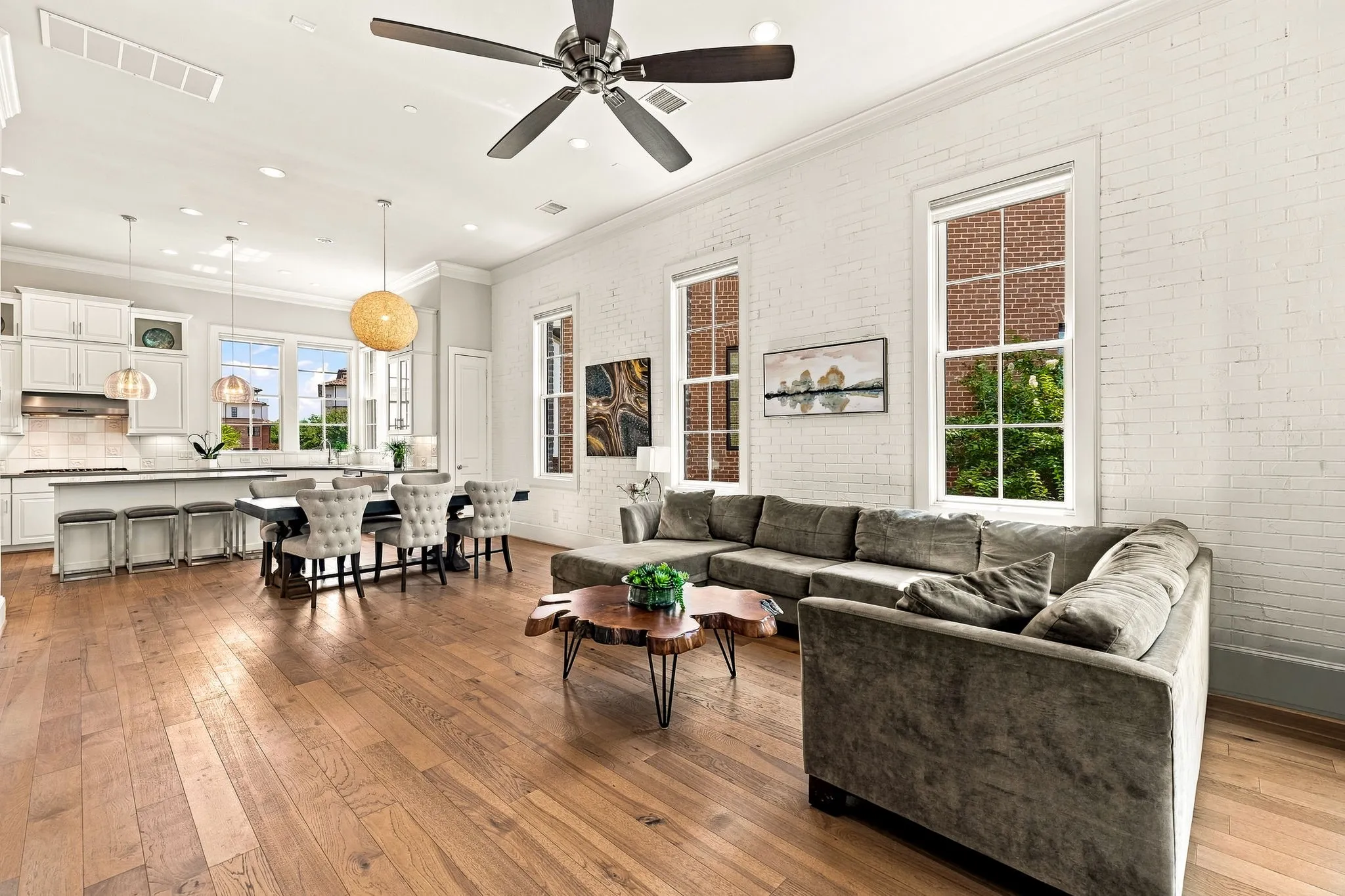 The open-concept floor plan creates a seamless flow between the kitchen, dining, and living spaces.