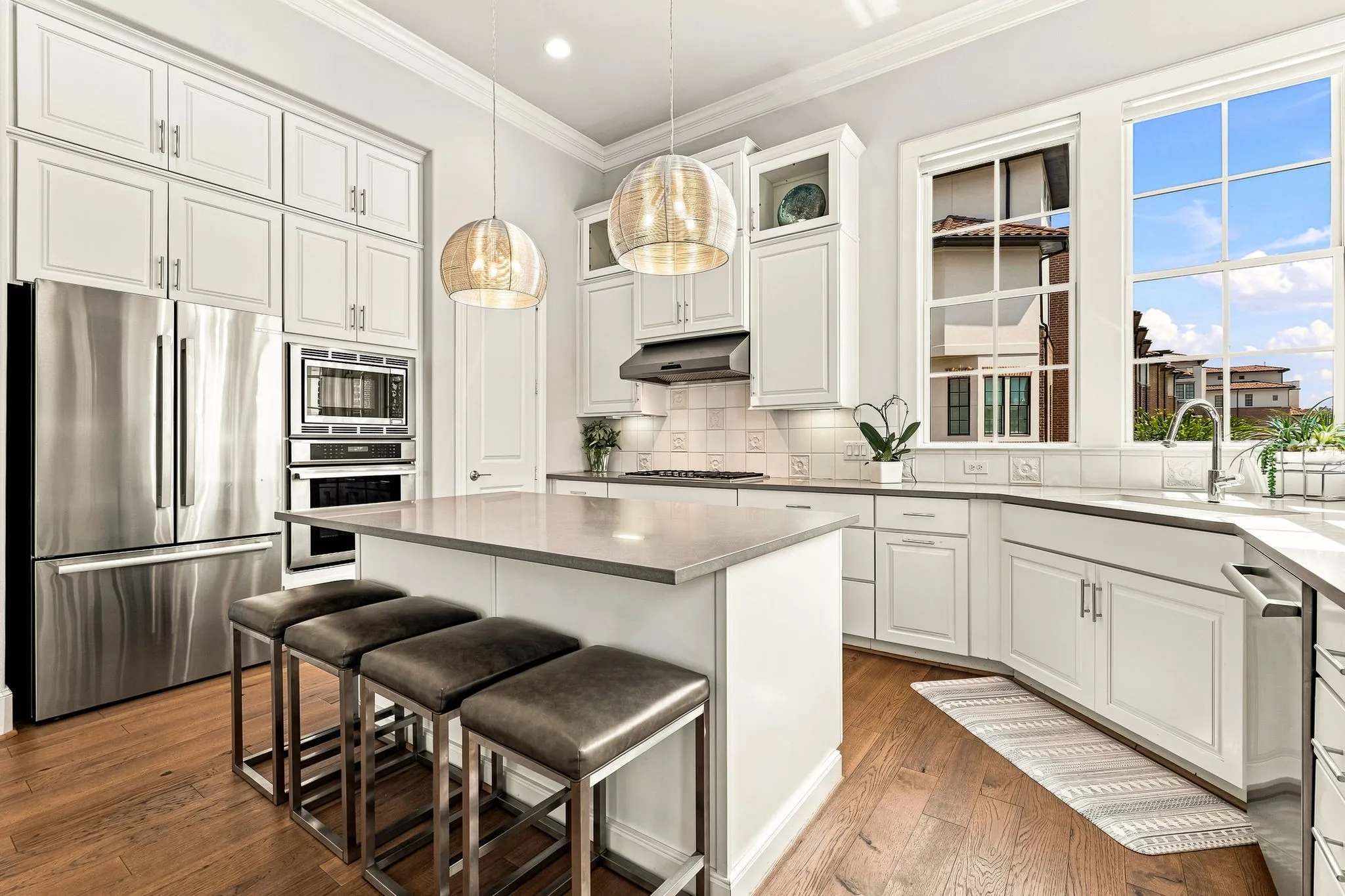 A spacious walk-in pantry provides ample storage and keeps everyday kitchen essentials organized and within easy reach.