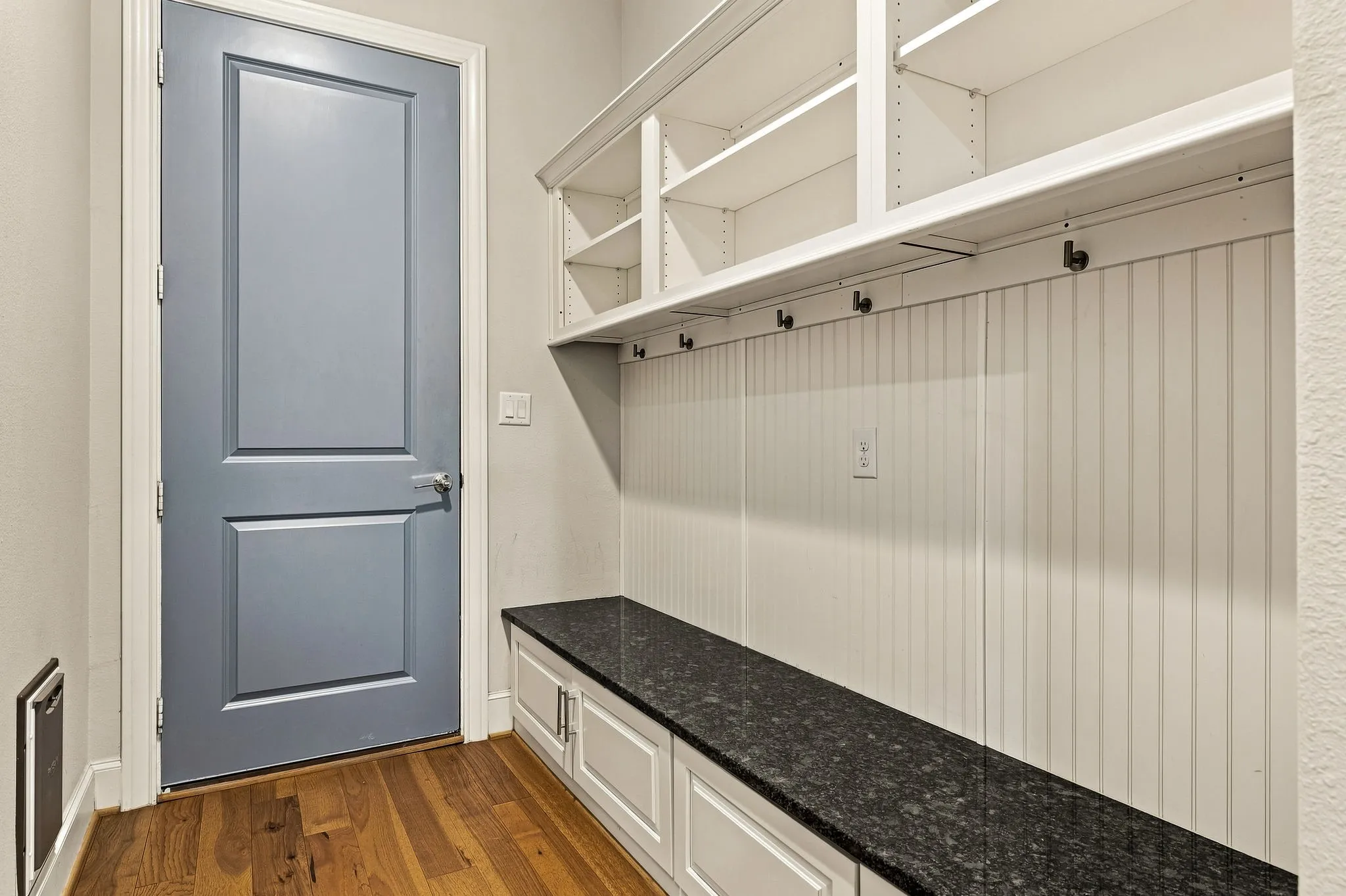 A mudroom provides a convenient drop zone with built-in storage to help keep everyday essentials organized.