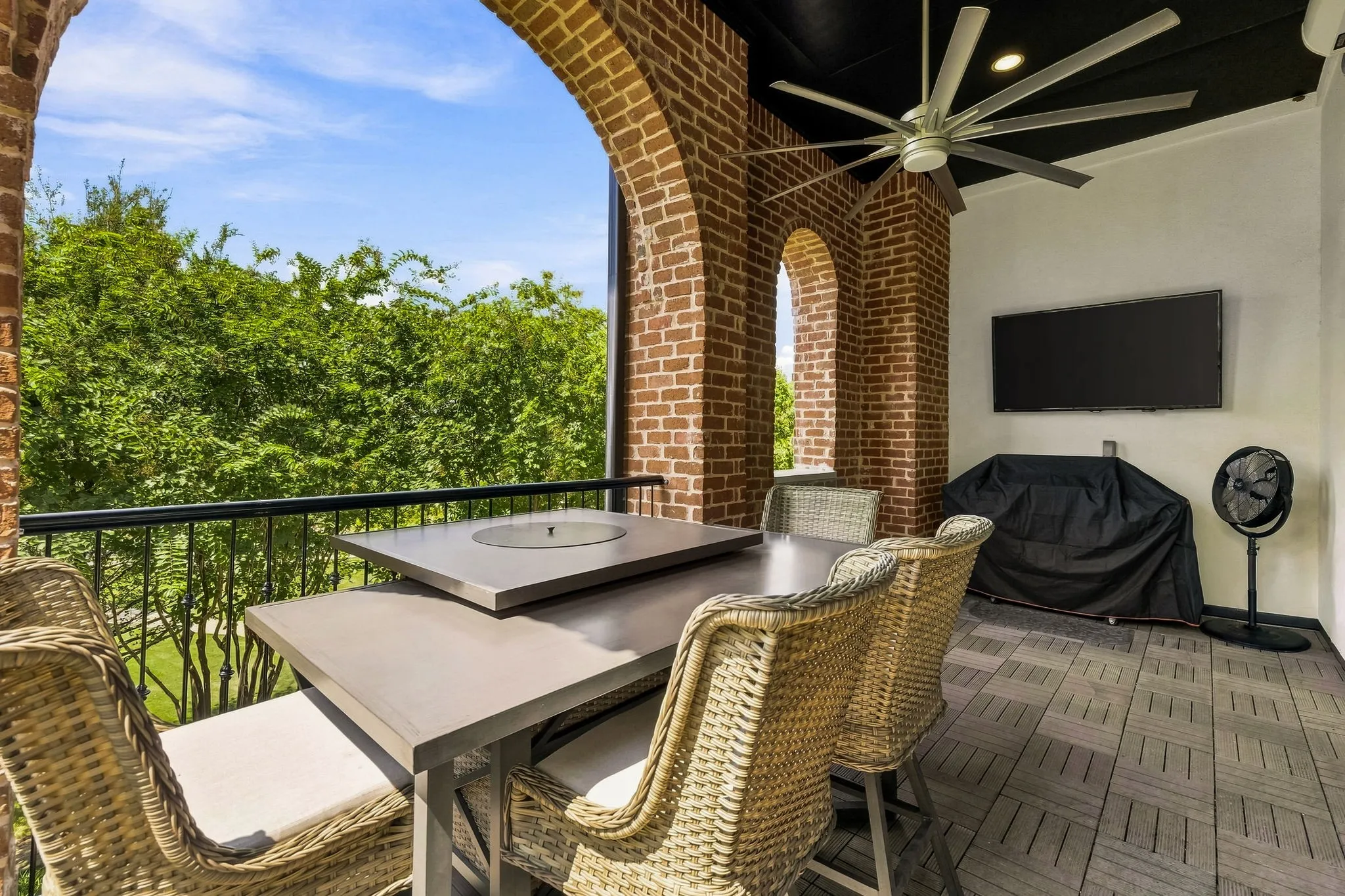 Spacious private balcony sits just above the tree canopy and offers stunning views.