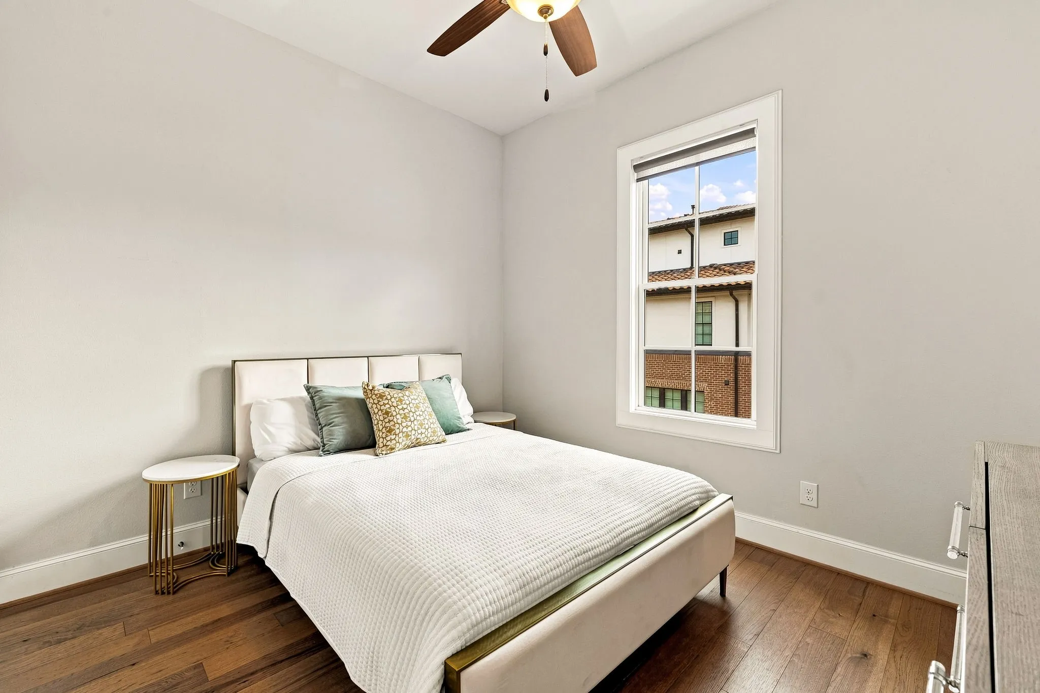 Third floor guest bedroom with en suite bathroom and two closets.