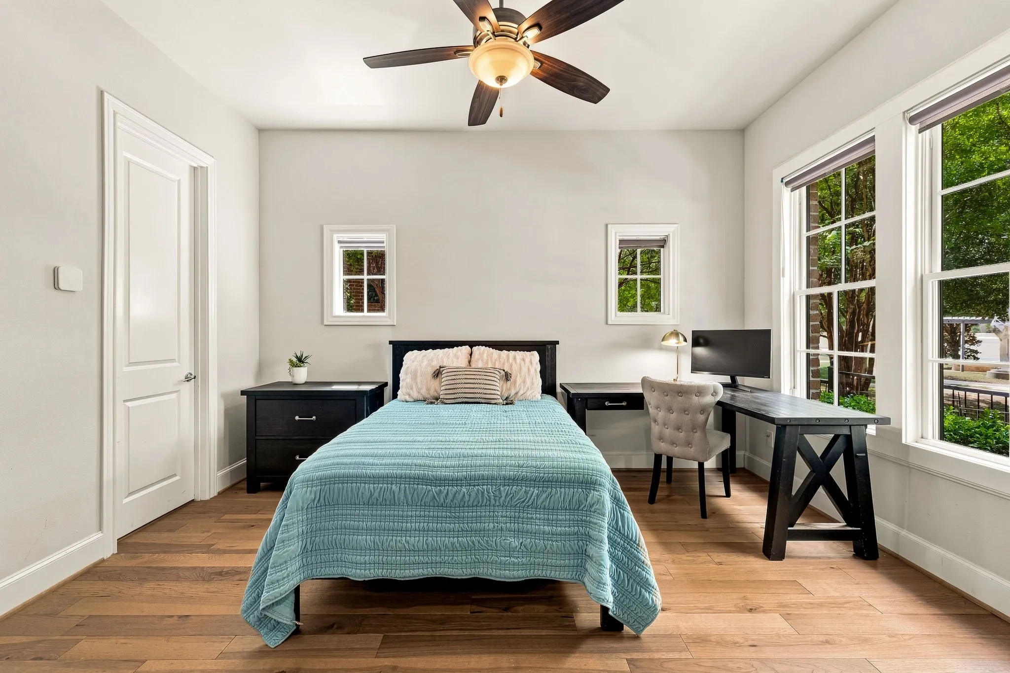 Spacious first floor guest bedroom with en suite bathroom and walk-in closet.