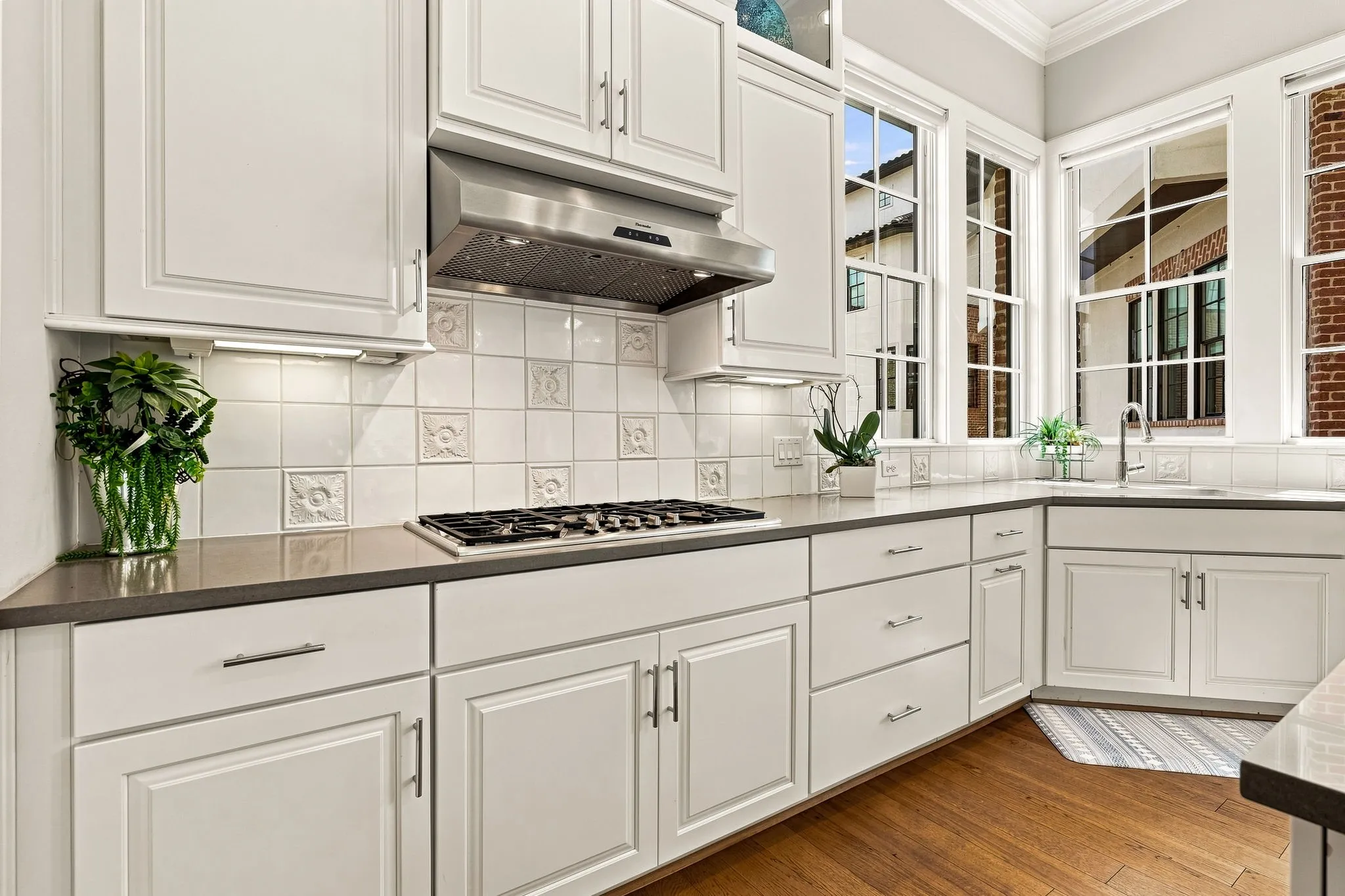 Abundant soft-close cabinetry and drawers provide generous storage while keeping the kitchen clean and organized.