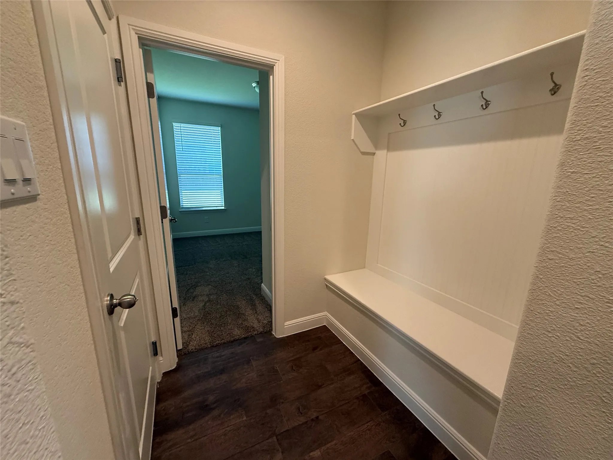 Built-in bench with upper shelf and coat hooks