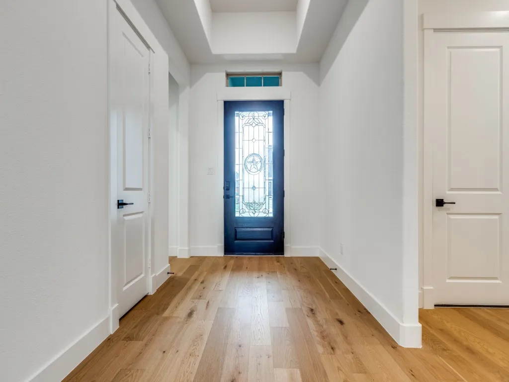 Featuring a beautiful 8' front entry door and trey ceiling, you will enjoy welcoming friends and family into this dream home!