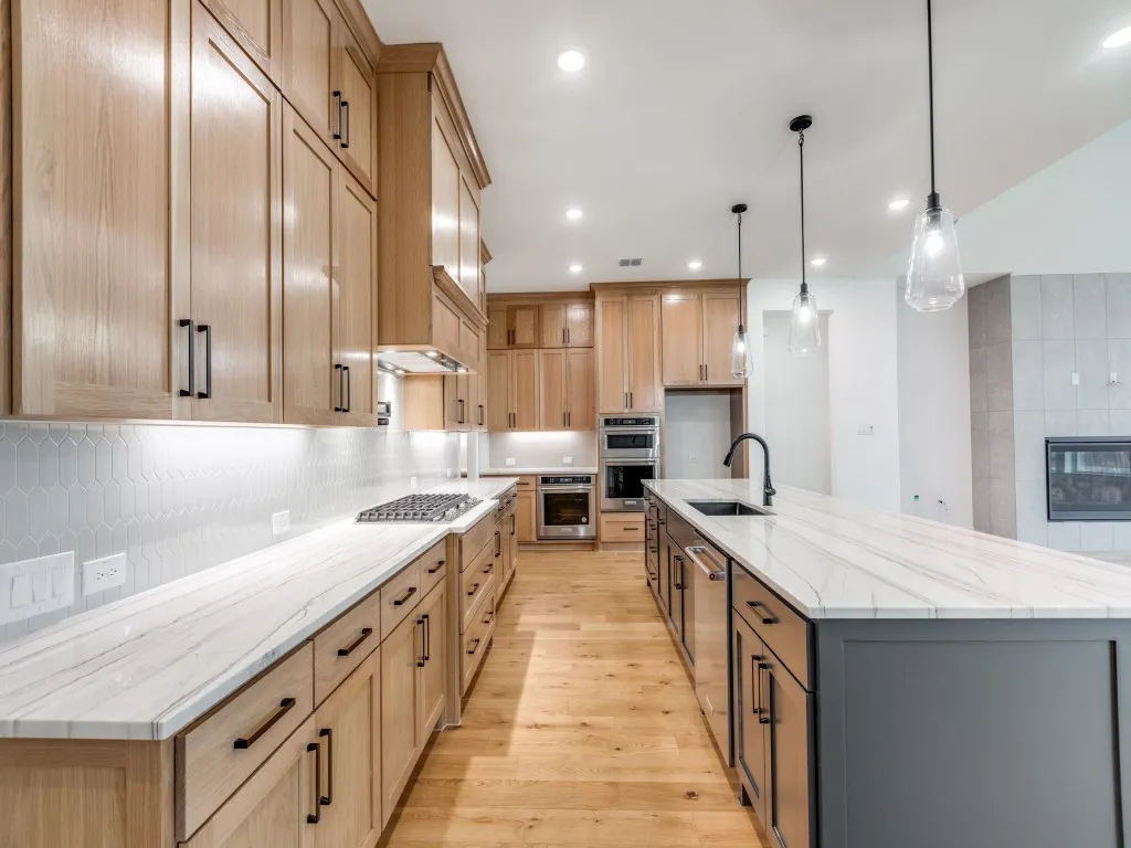 Beautiful cabinetry, gorgeous countertops, ample prep space and top of the line appliances make this a kitchen any chef would be proud to call their own!