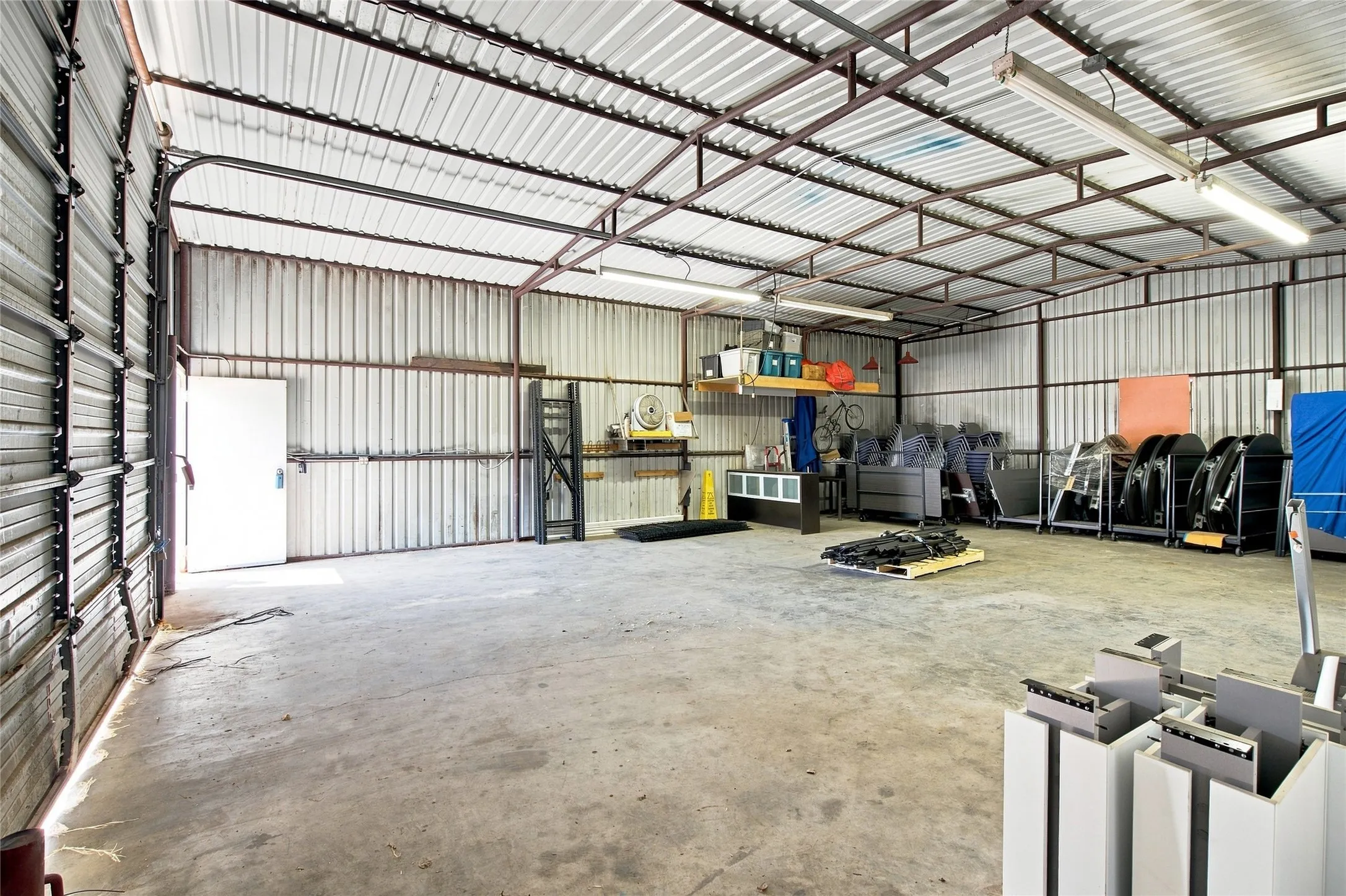 Metal-clad interior with a roll-up door