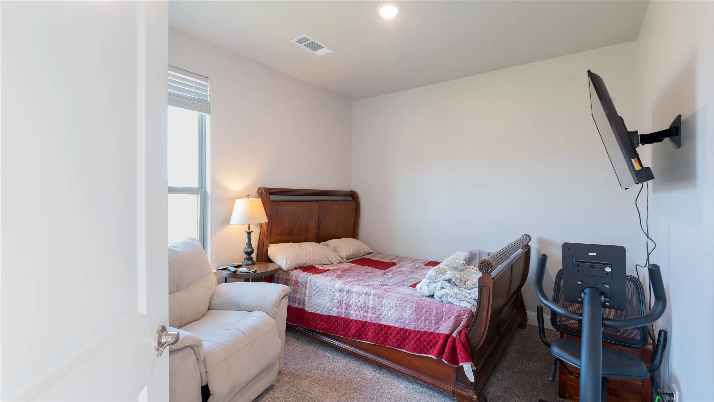 Recessed lighting and a window with horizontal blinds