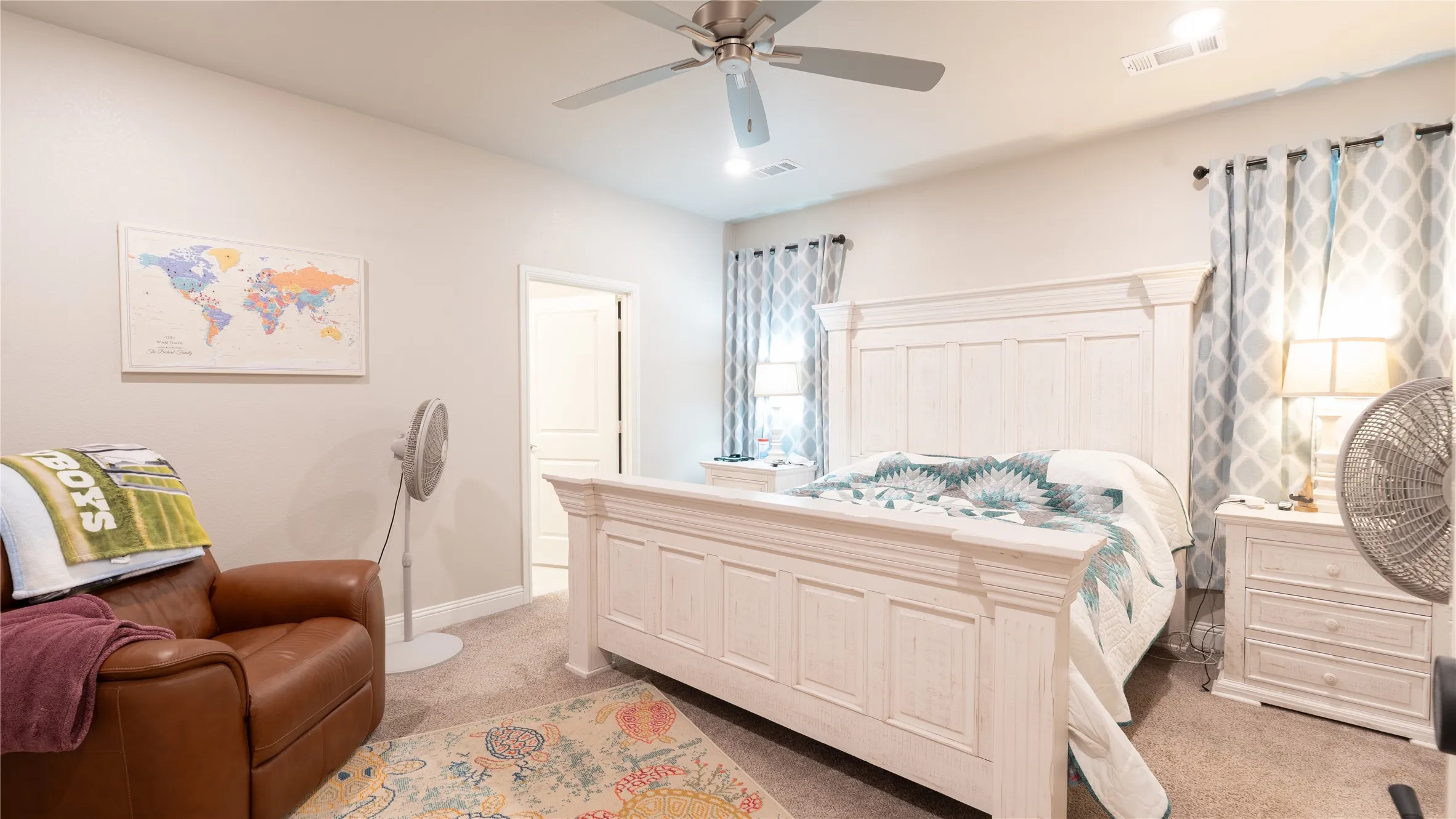 Recessed lighting, ceiling fan, and carpeted flooring