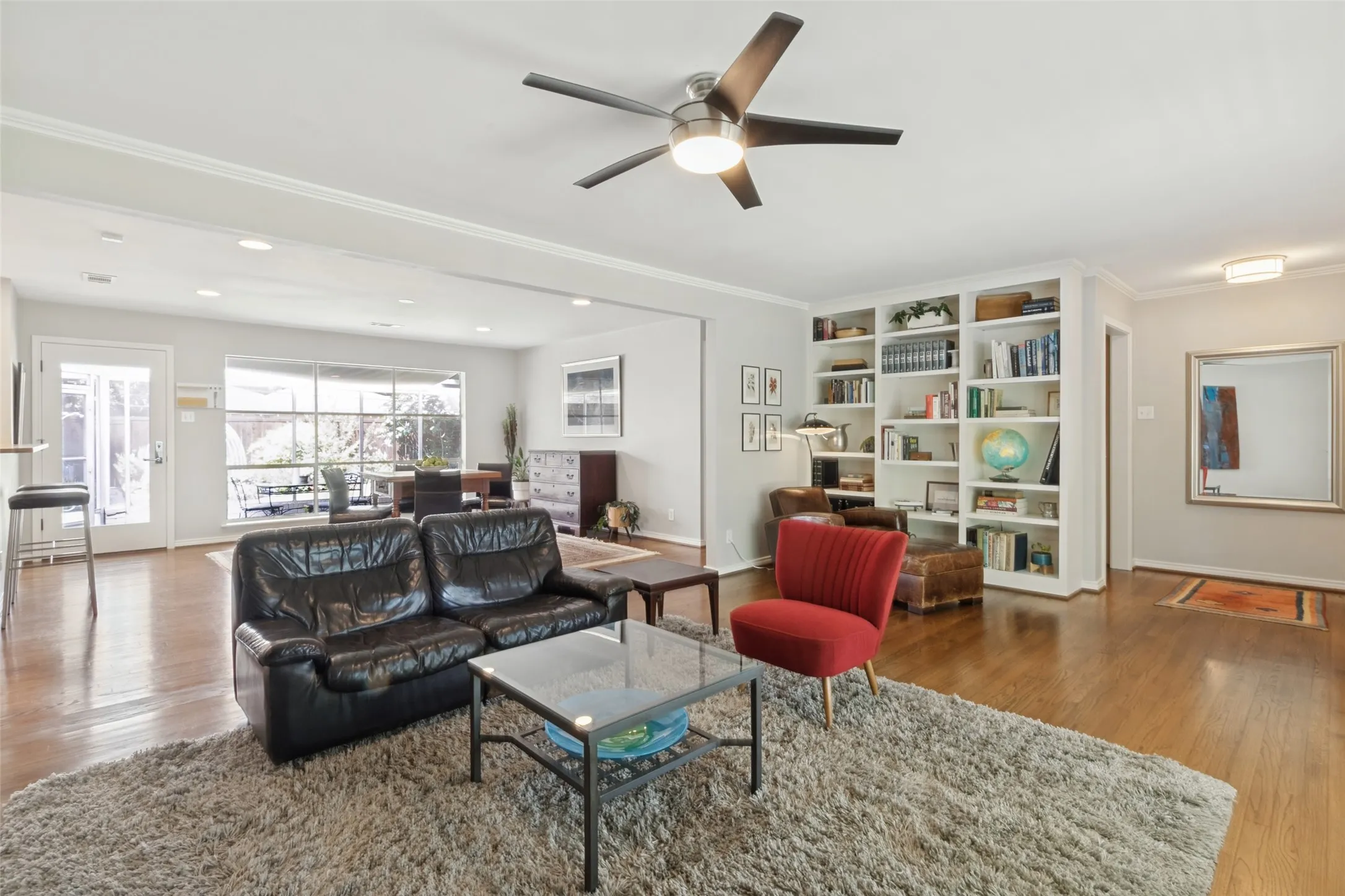 Original Hardwood floors throughout, bright recessed lighting, and a contemporary ceiling fan