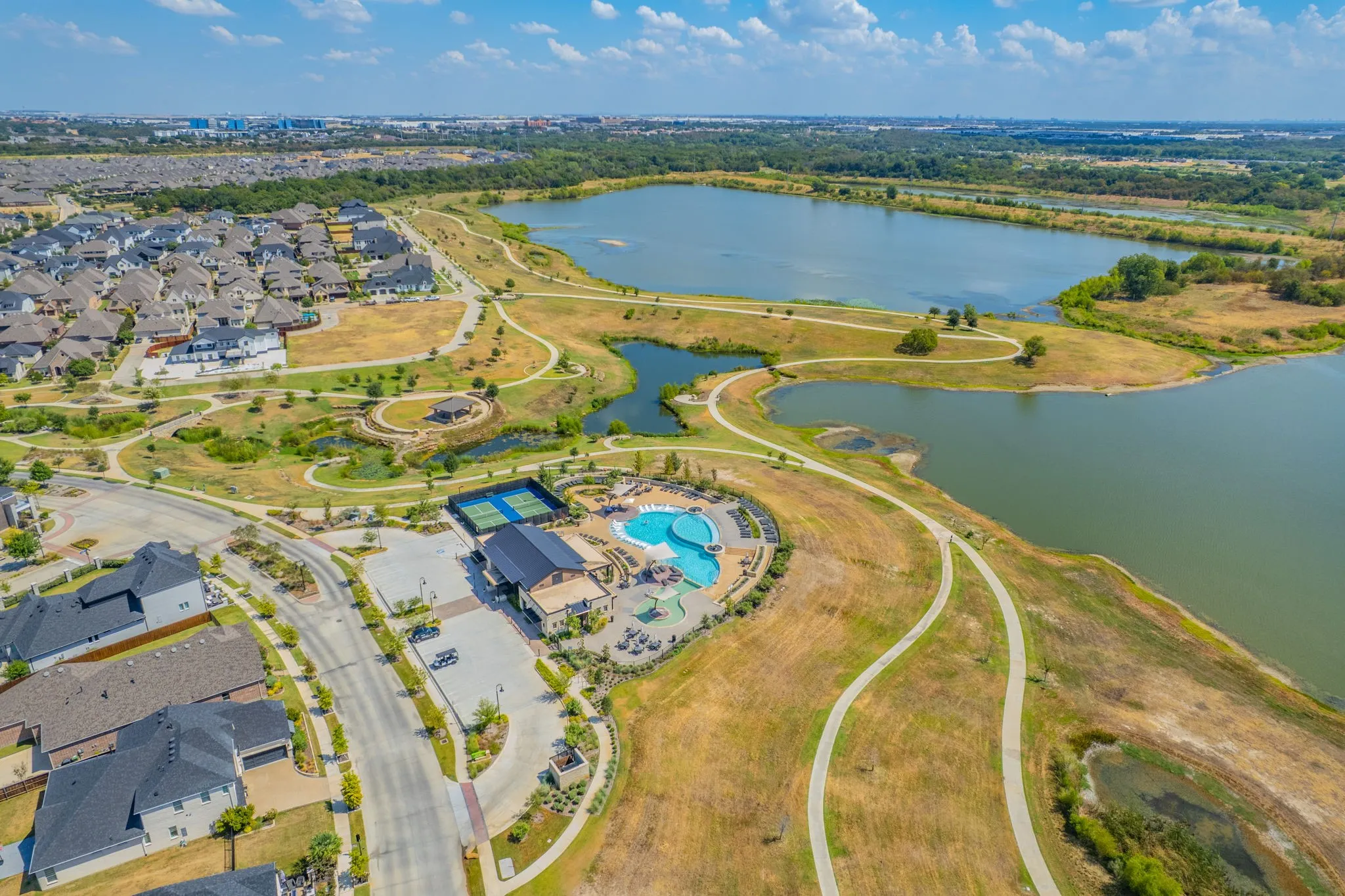 Community amenities featuring a swimming pool, tennis courts, and clubhouse