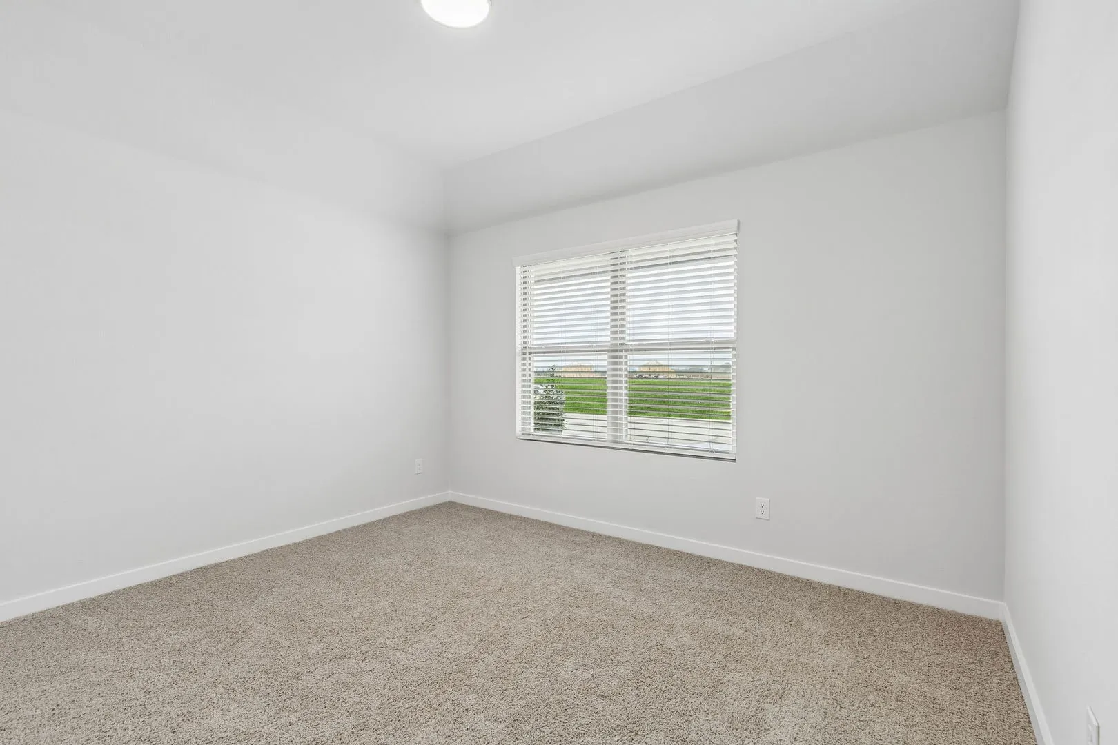 Bedroom in the Oscar home plan by Trophy Signature Homes – REPRESENTATIVE PHOTO