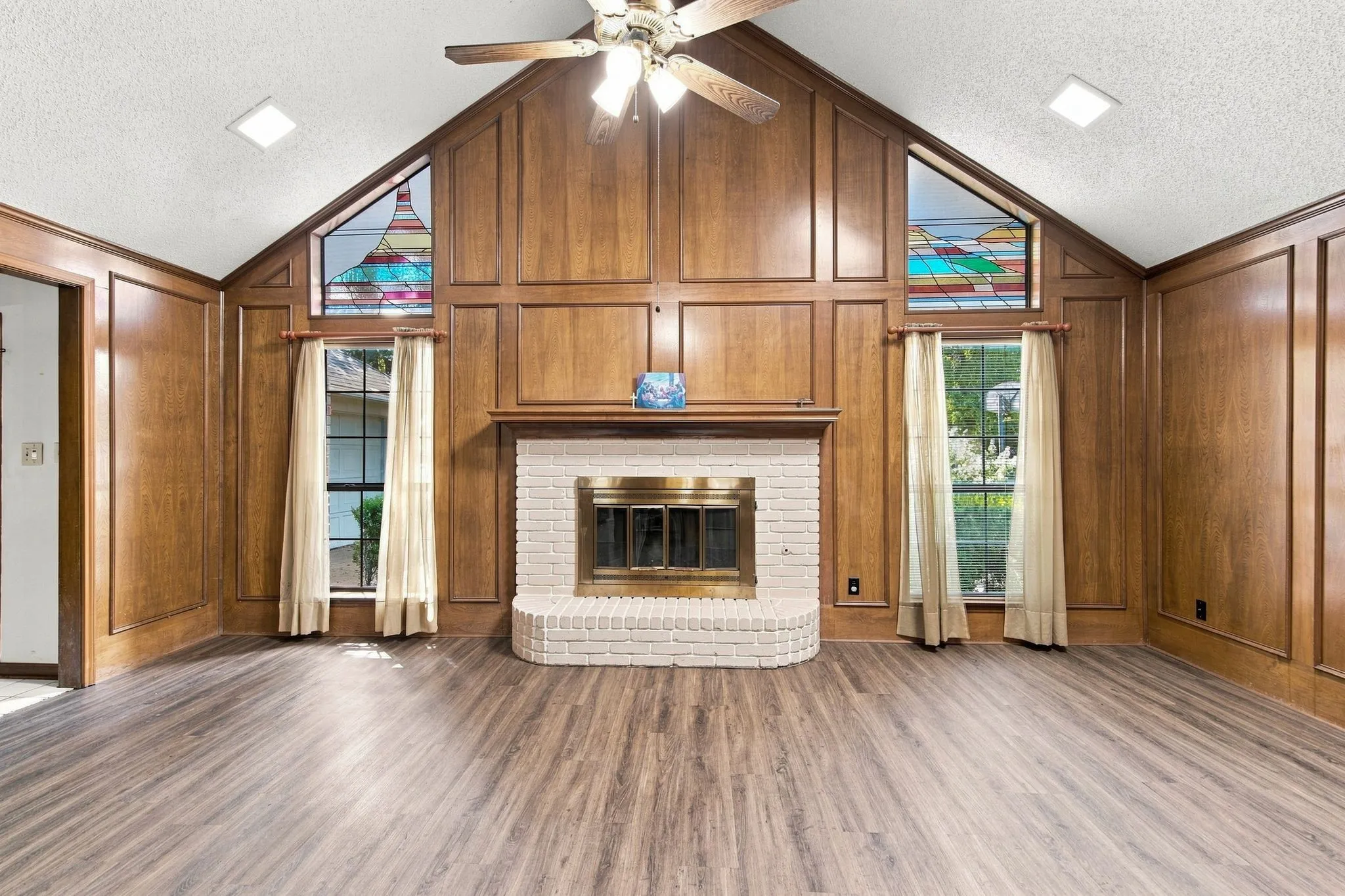 Vaulted ceiling featuring recessed lighting and a ceiling fan