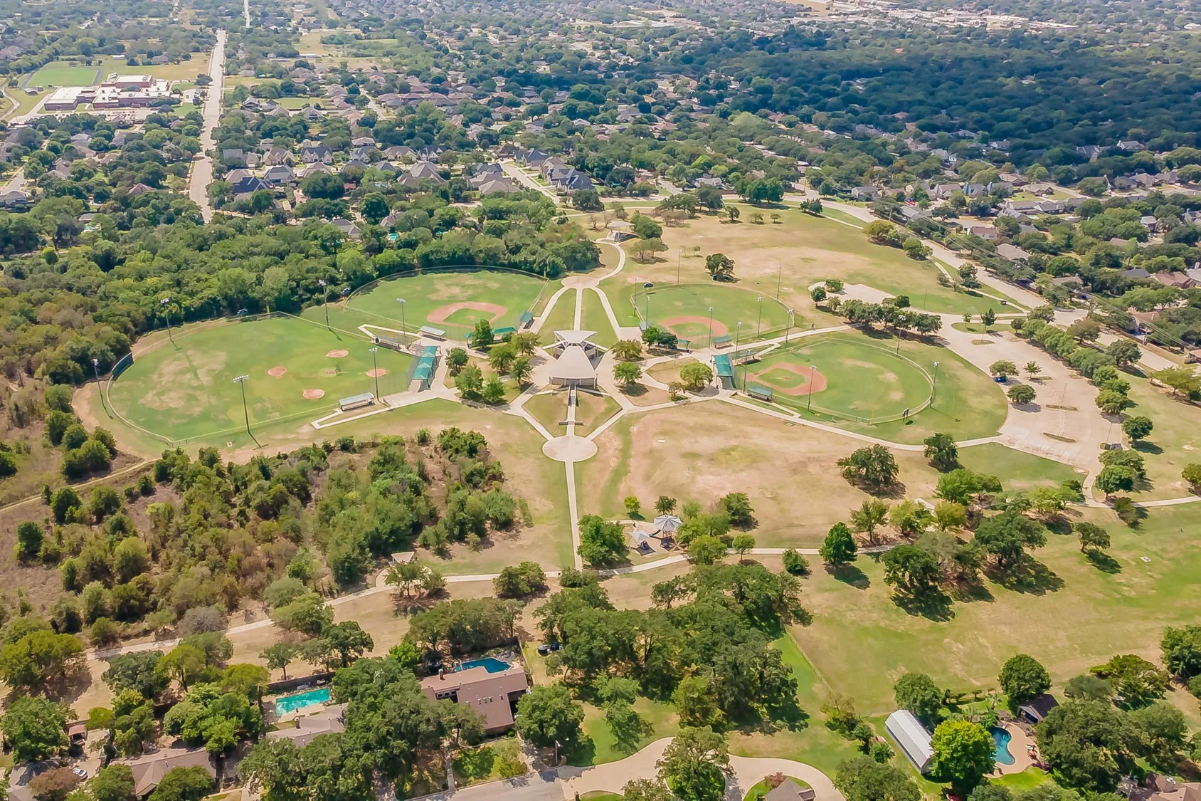 Walking distance to the Cross Timbers Park. Expansive 100 acre recreational park featuring multiple baseball fields, walking paths, and mature trees, surrounded by residential areas