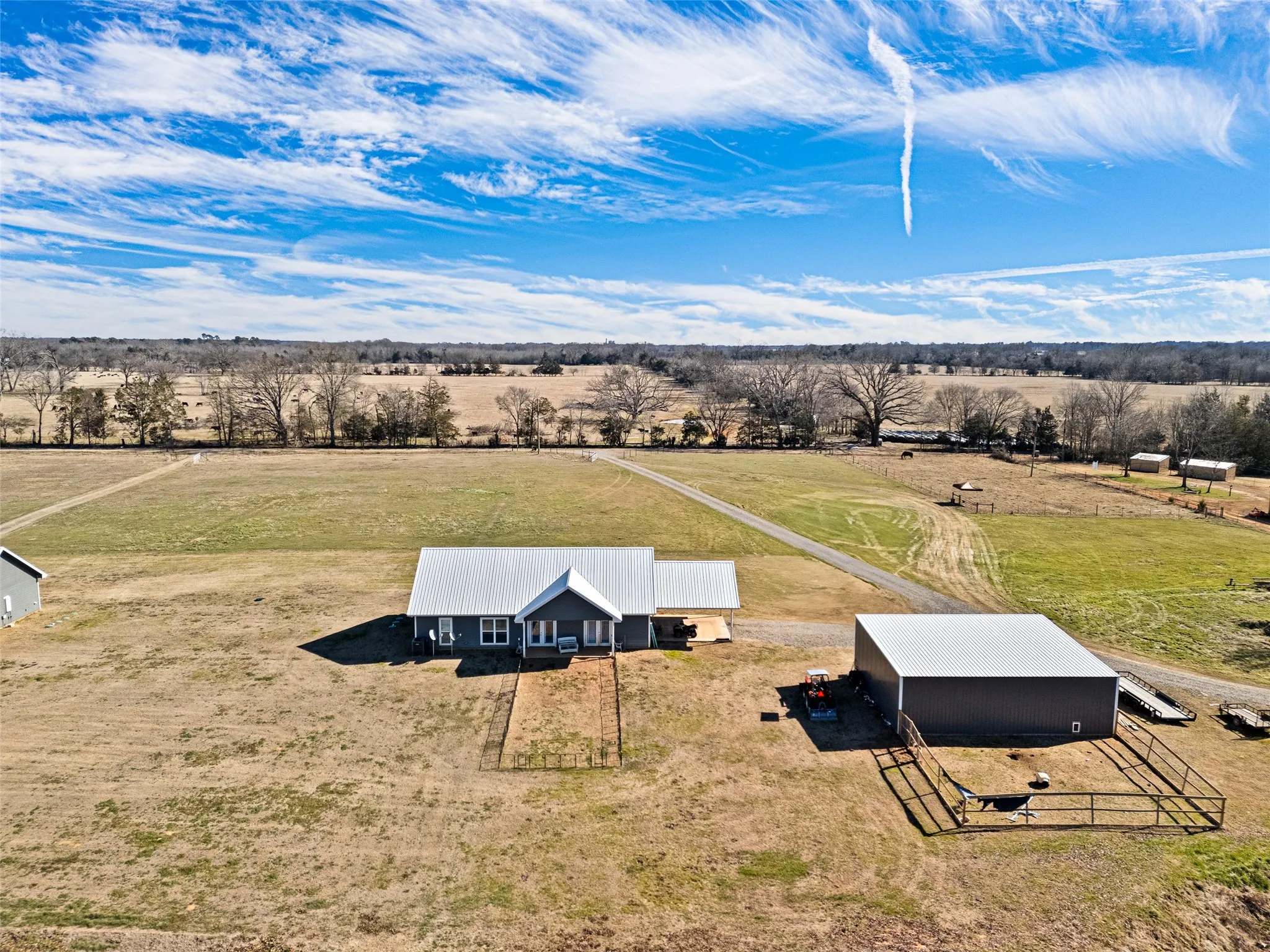 Birds eye view of property featuring a rural view