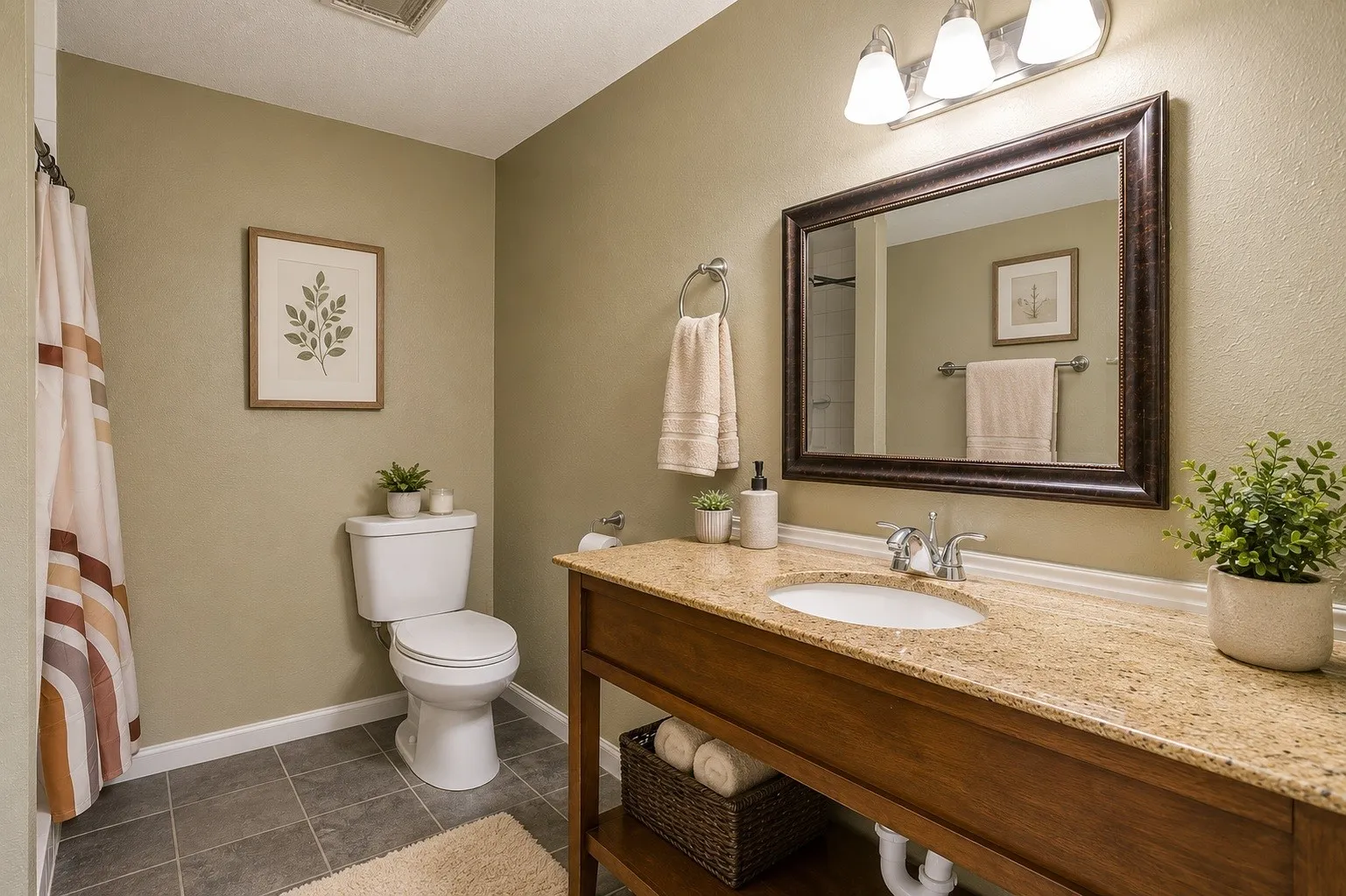 Bathroom featuring a single vanity with an integrated sink, polished chrome faucet, and a stone-finish countertop. Virtually staged using AI.