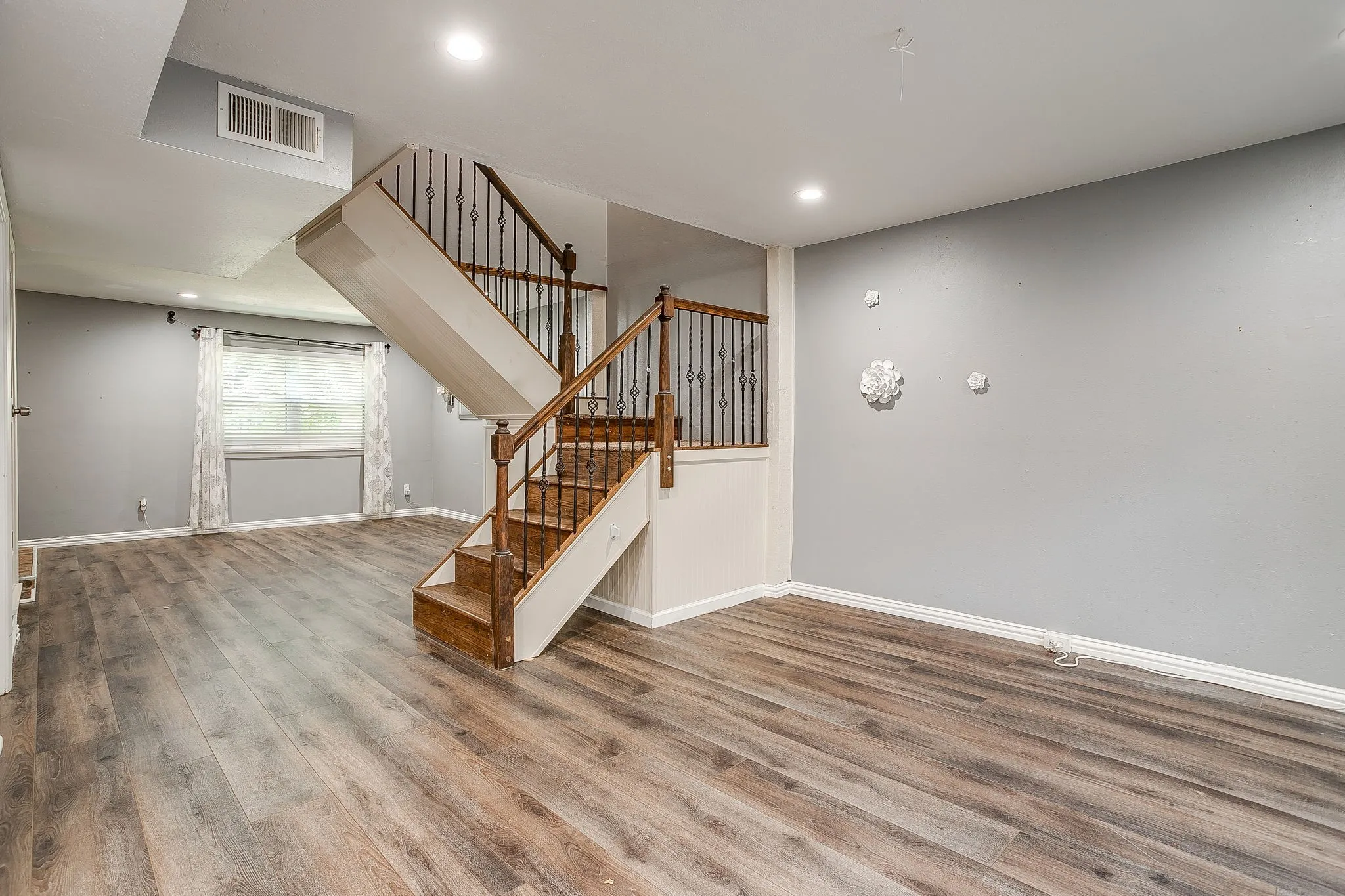 staircase dividing living and dining spaces