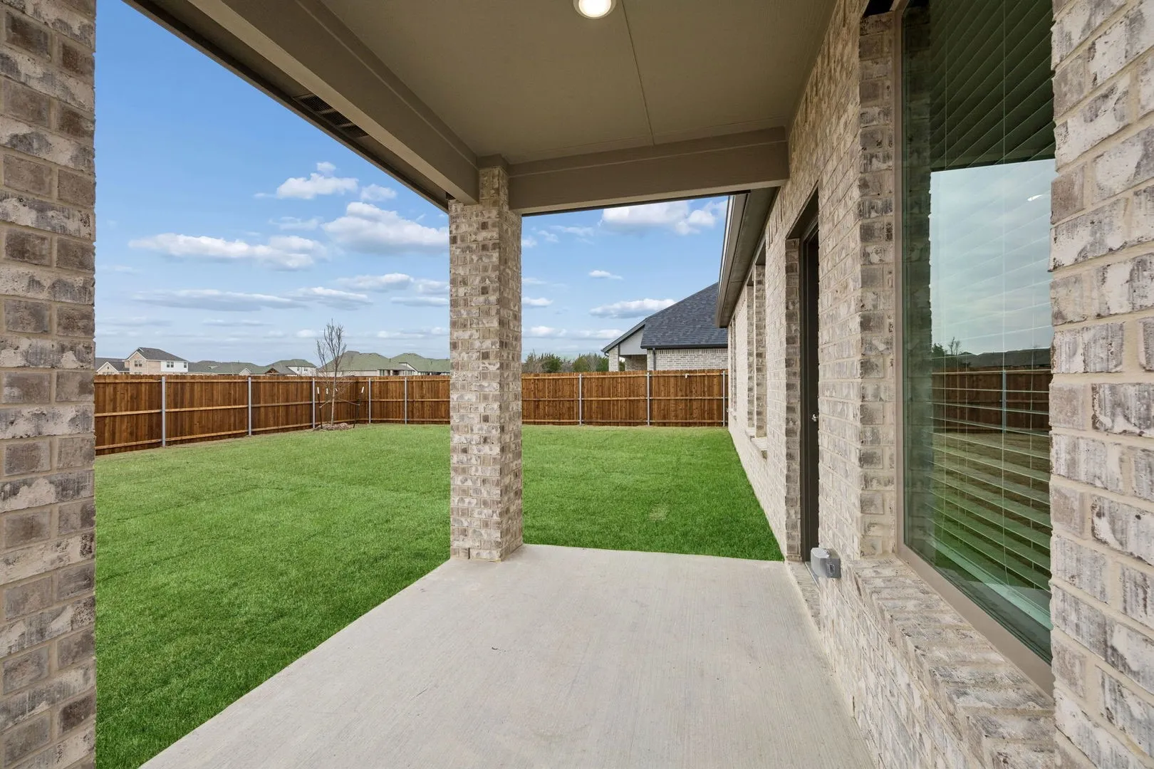 Covered Patio in the Masters home plan by Trophy Signature Homes – REPRESENTATIVE PHOTO