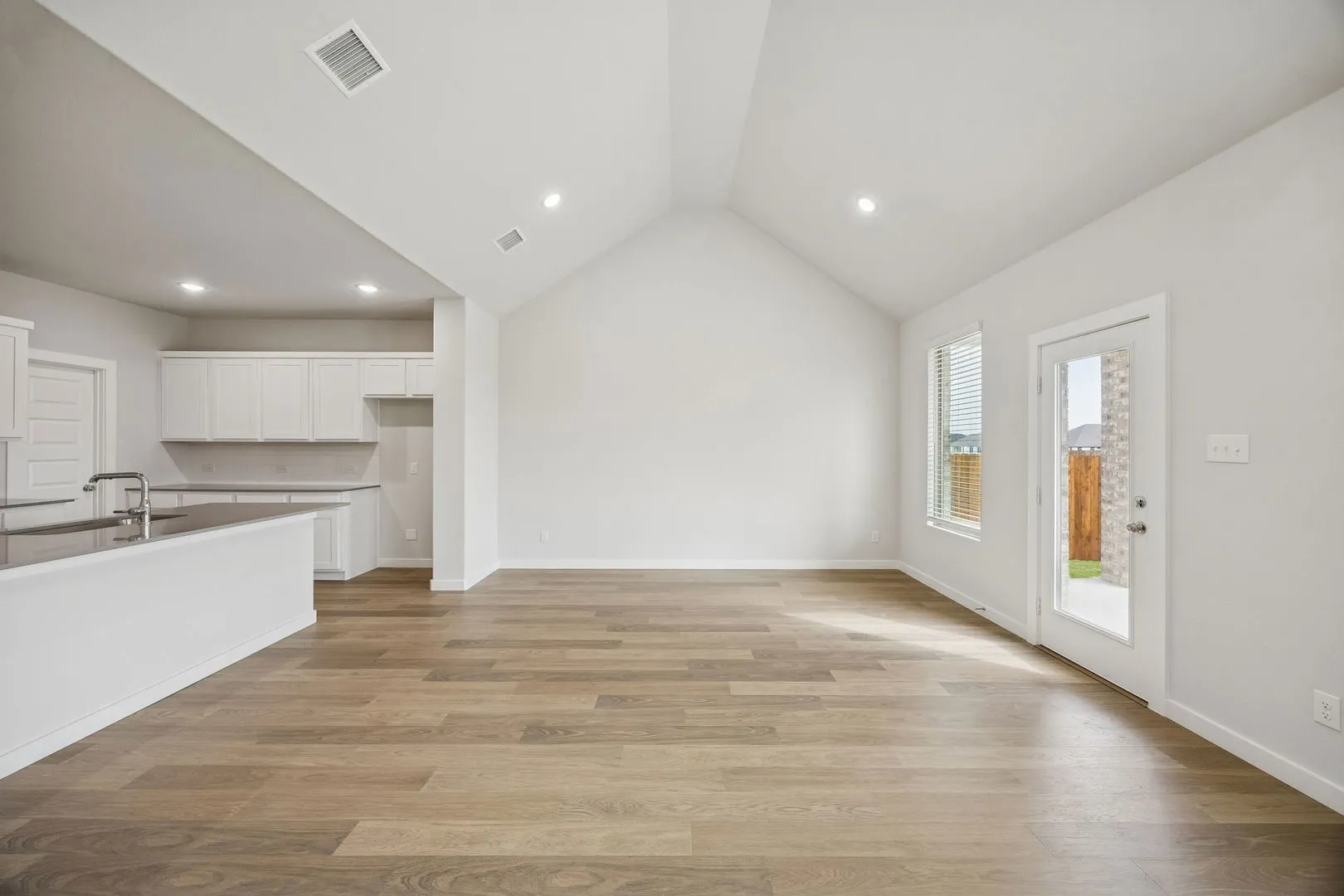 Living and Dining Rooms in the Masters home plan by Trophy Signature Homes – REPRESENTATIVE PHOTO