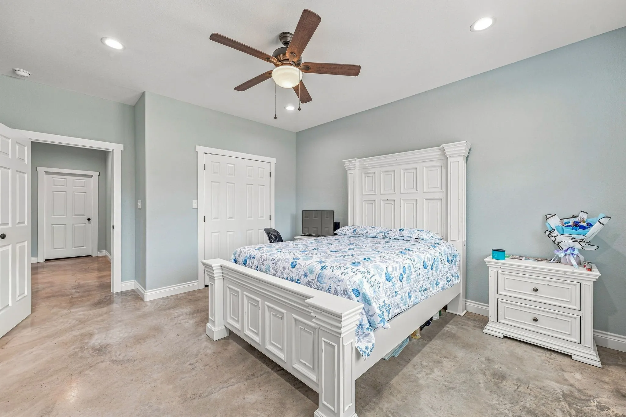Recessed lighting, ceiling fan, wood-finish flooring, and white trim