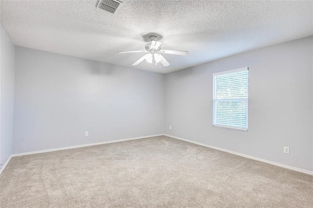 Sloped ceiling and neutral carpeting