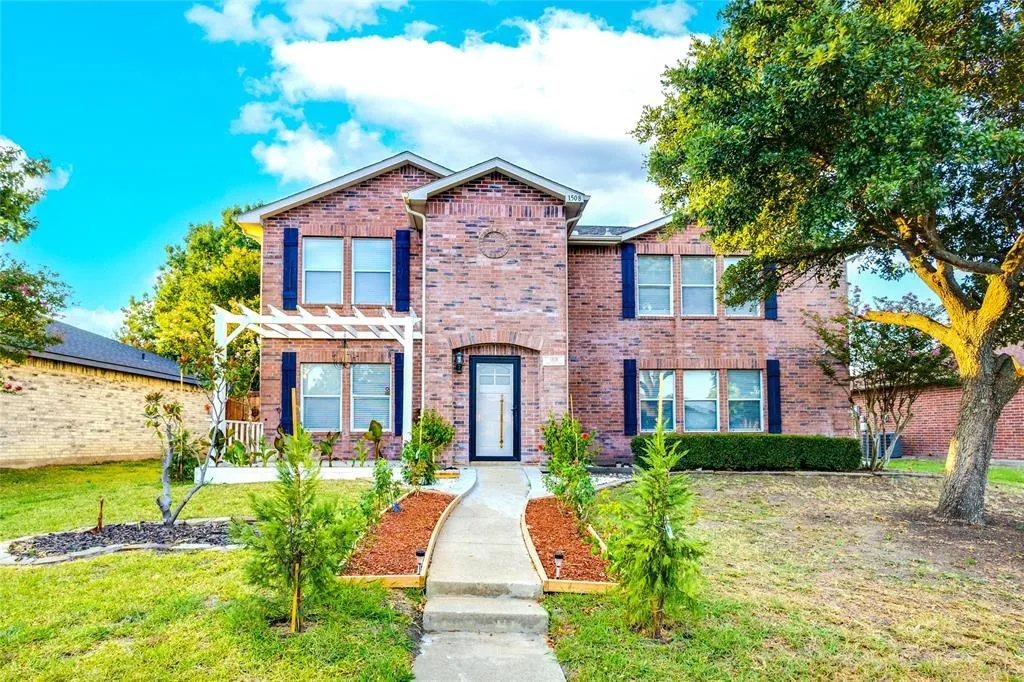 Brick exterior with contrasting dark shutters