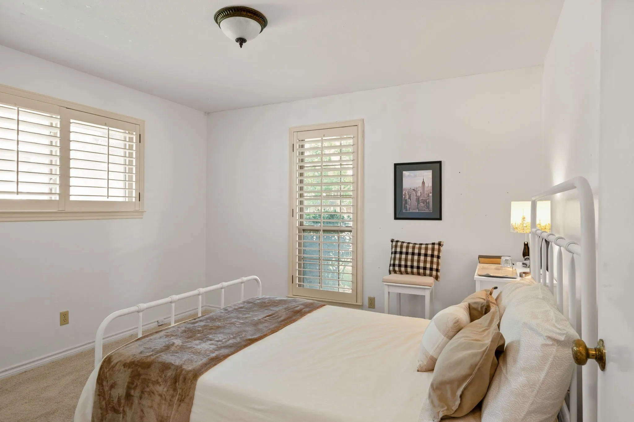 White interior walls with a neutral carpet