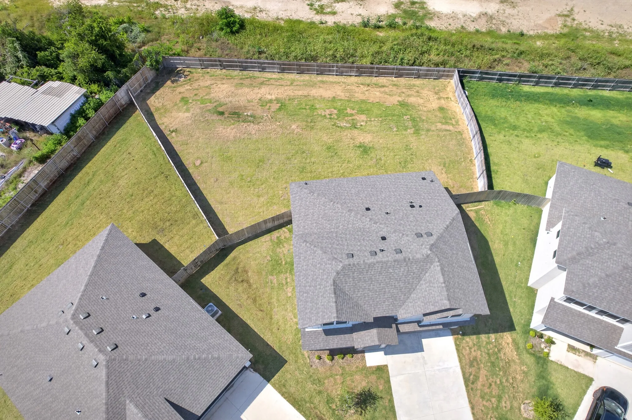 Property with a fenced perimeter and a spacious grassy area