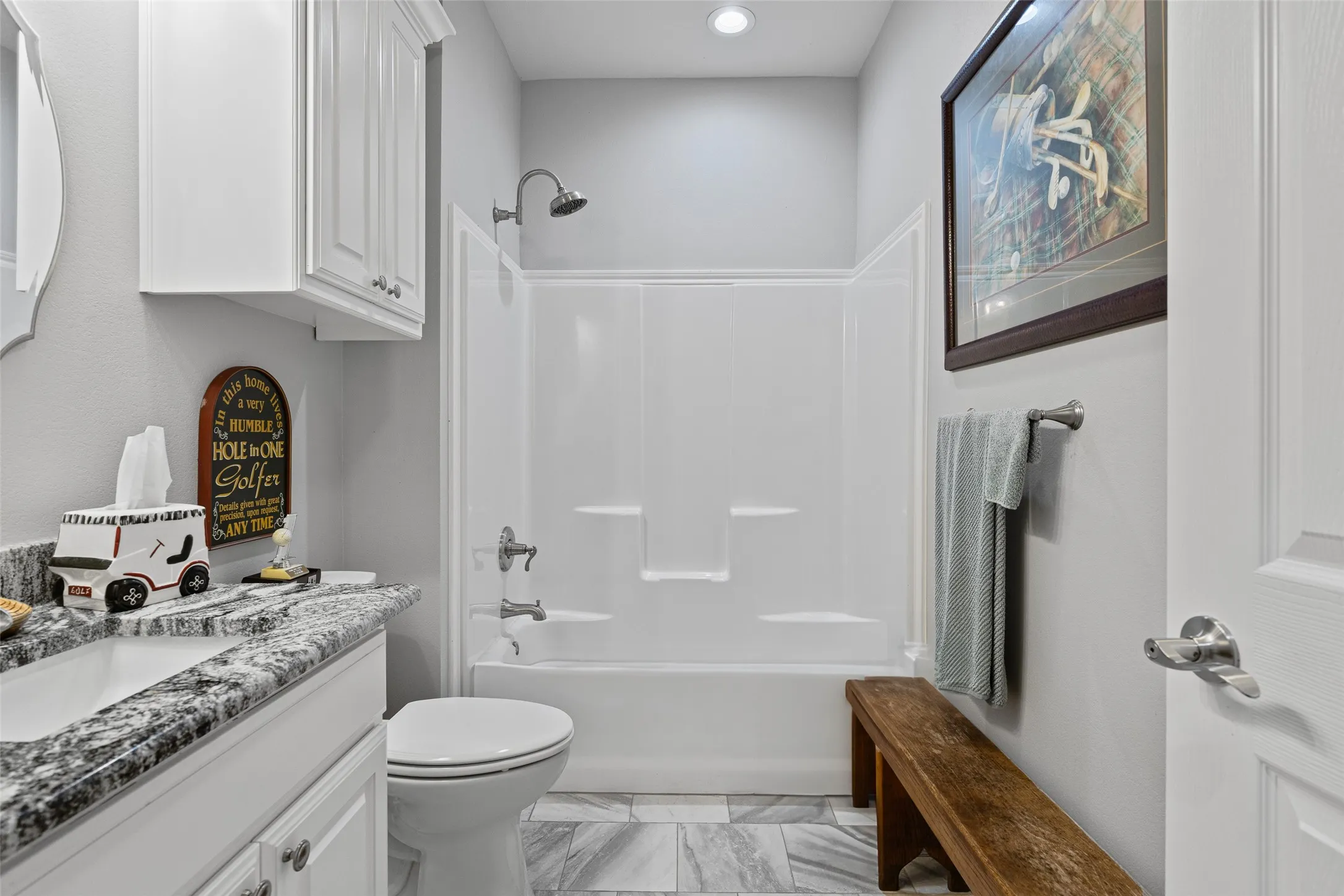 Full bathroom featuring bathing tub / shower combination, vanity, and toilet