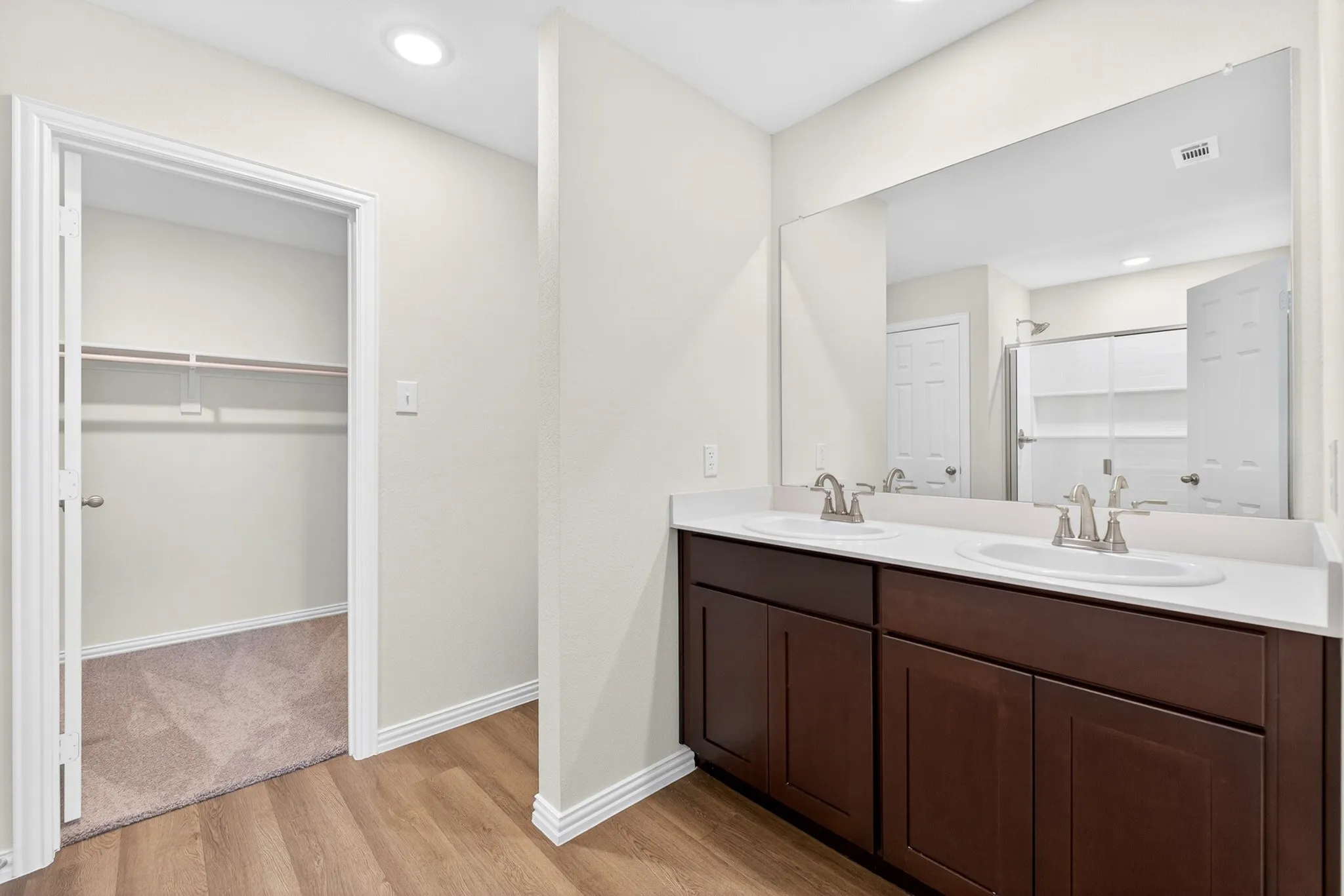 Neutral-toned walls with light-colored carpeting