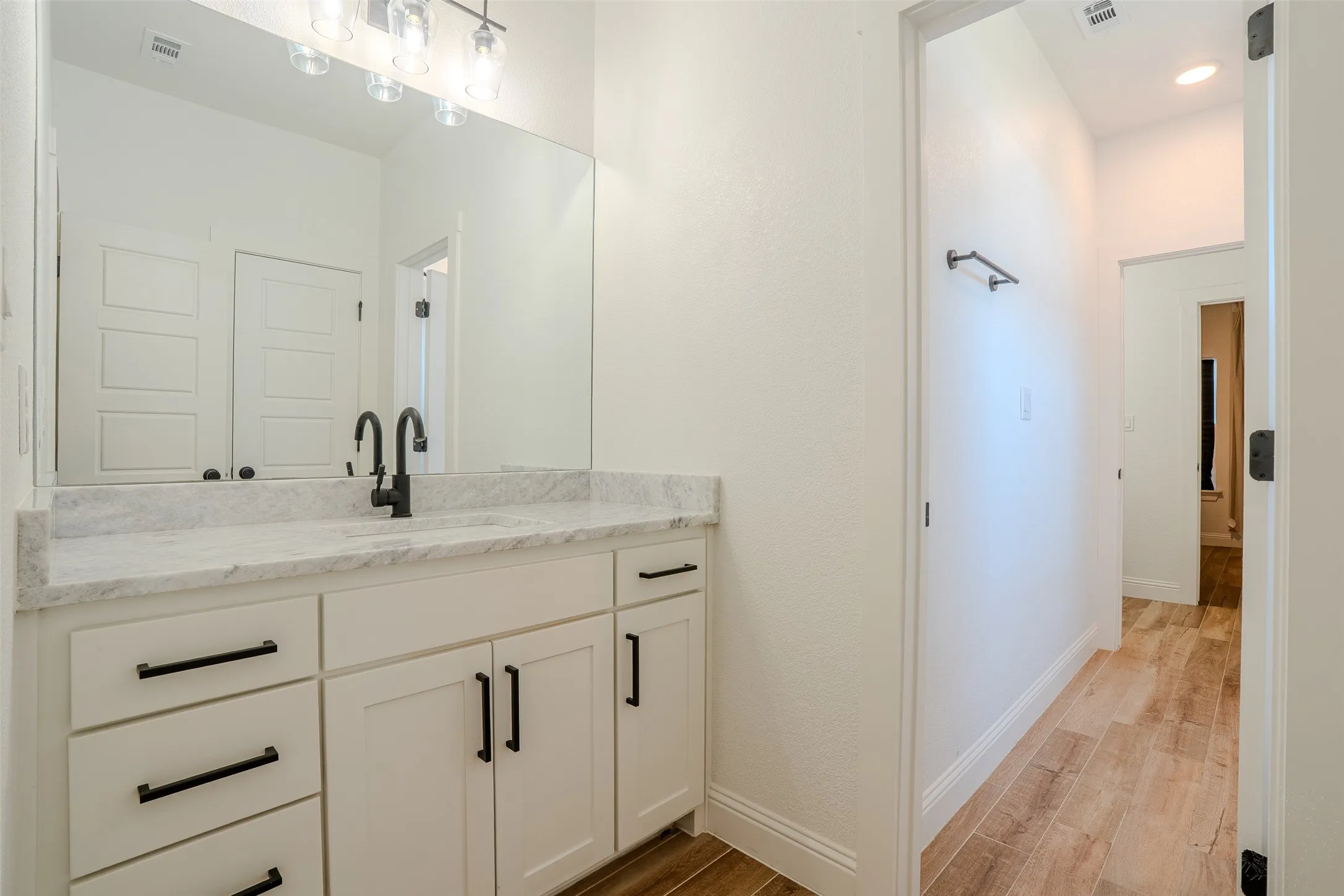 Jack and Jill Bathroom with vanity right off of Bedroom #3, and matte black fixtures