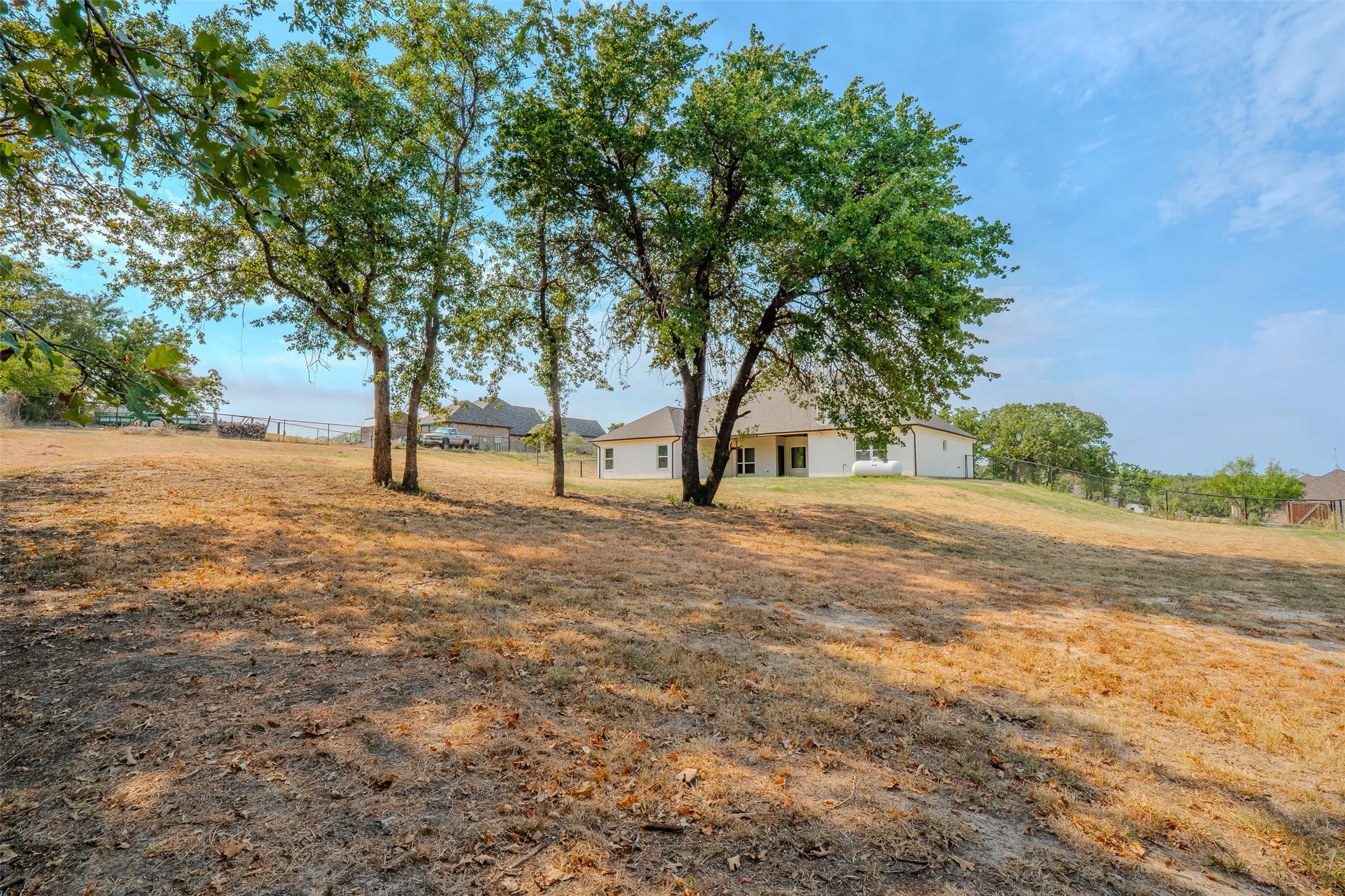 A hammock to relax under or a tree swing for the kids to make memories with. This property has several places that allow you to enjoy the sights and sounds that nature offers. featuring mature trees, NO BACK NEIGHBORS, and fully fenced back yard.