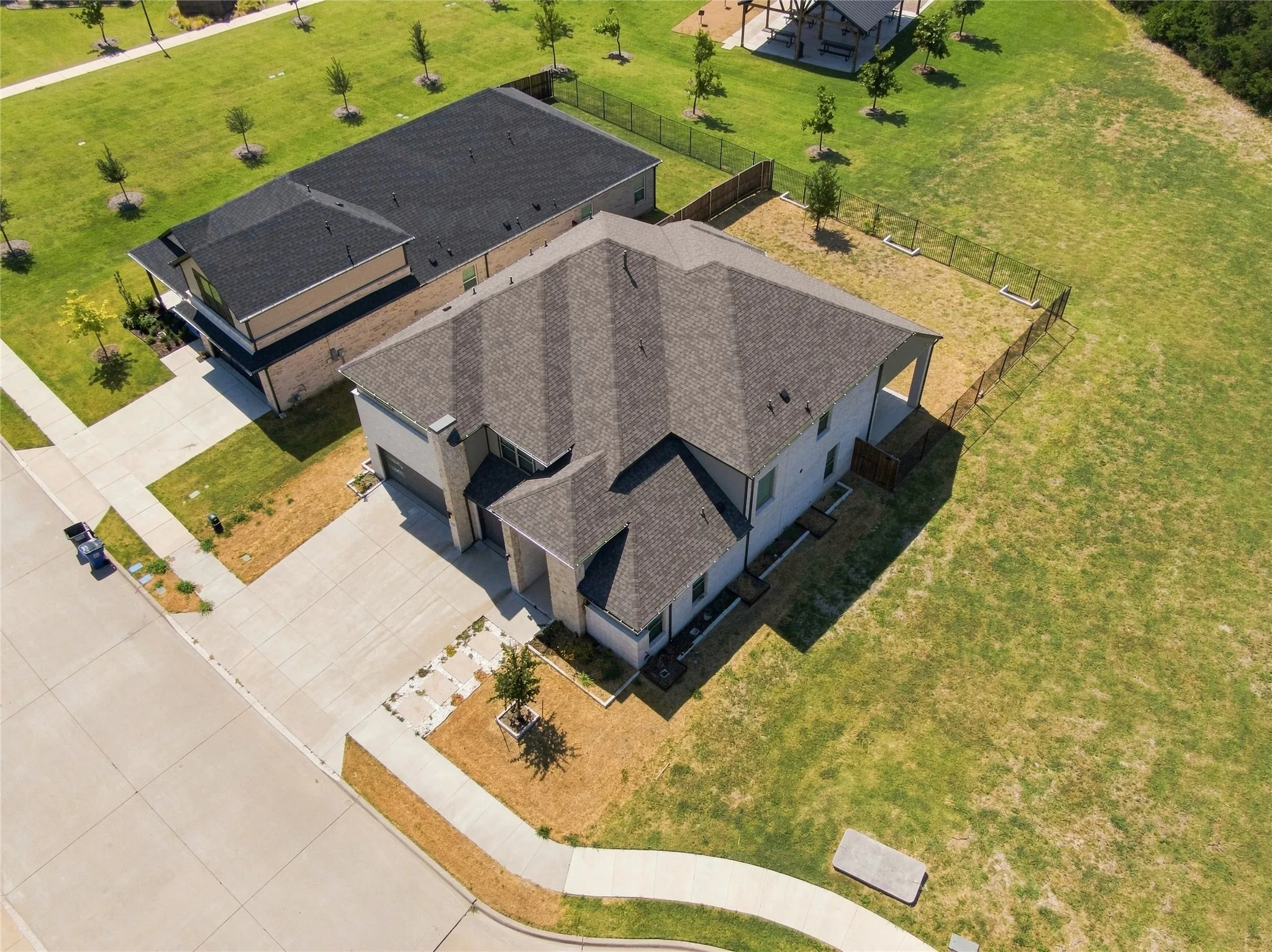 Modern residential property featuring a multi-gabled roofline and attached garage