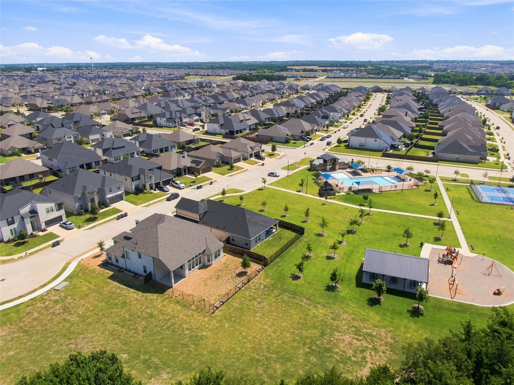 Community pool, tennis court, playground, and extensive green spaces
