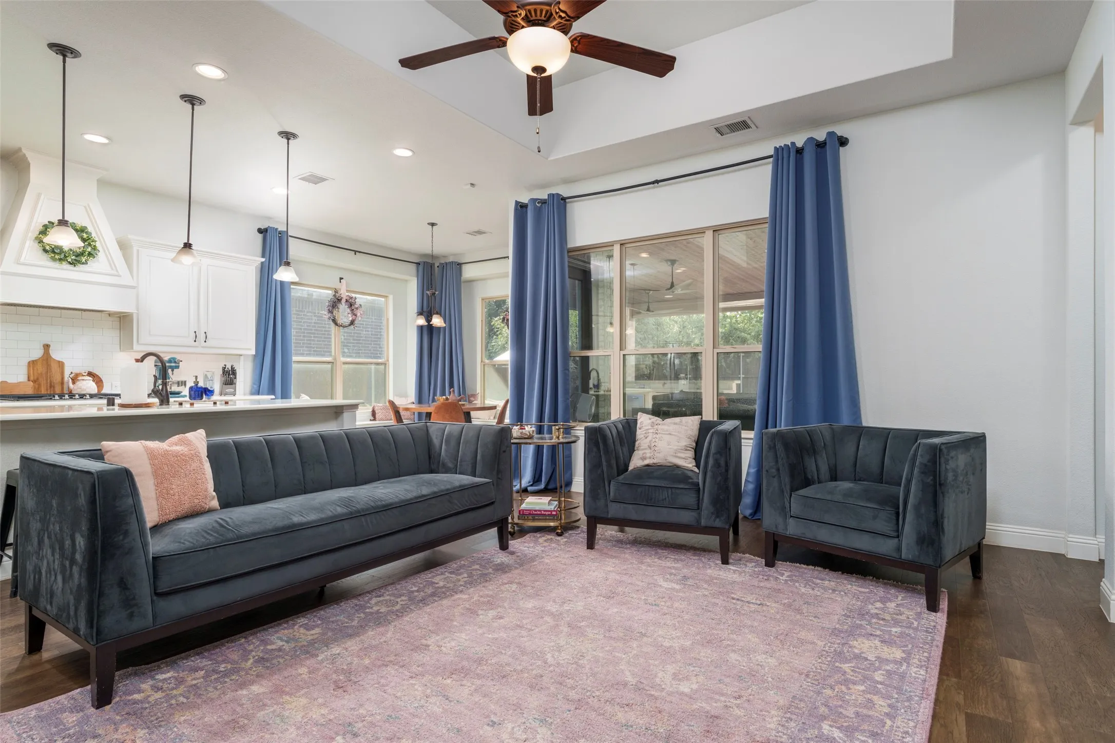 Family room area is large and great for family gatherings as dinner is being prepared.