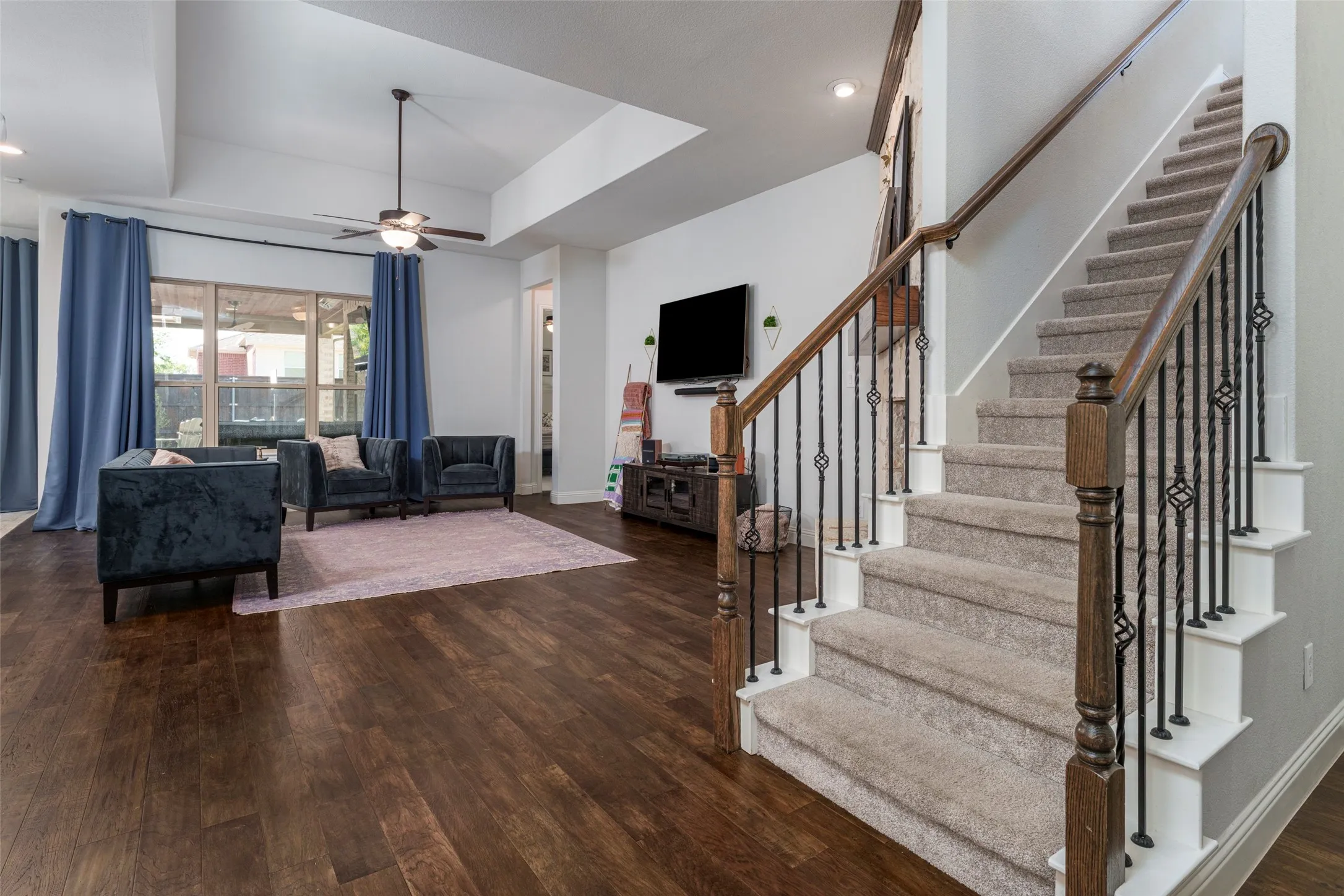 Enter into the spacious open concept area with stairs leading up to the game room and second floor.
