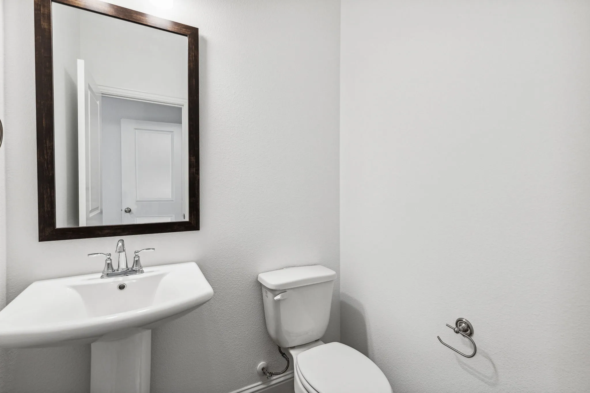 Powder Bath on the First Floor with Elegant Pedestal Sink