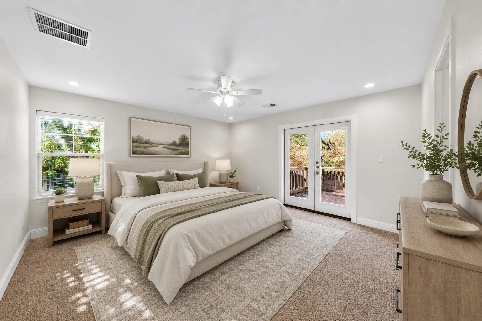 Wall-to-wall carpeting and neutral wall tones provide a spacious feel