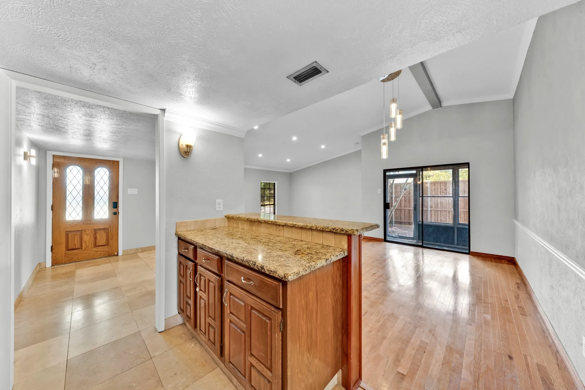 Entryway with leaded glass door and tile flooring