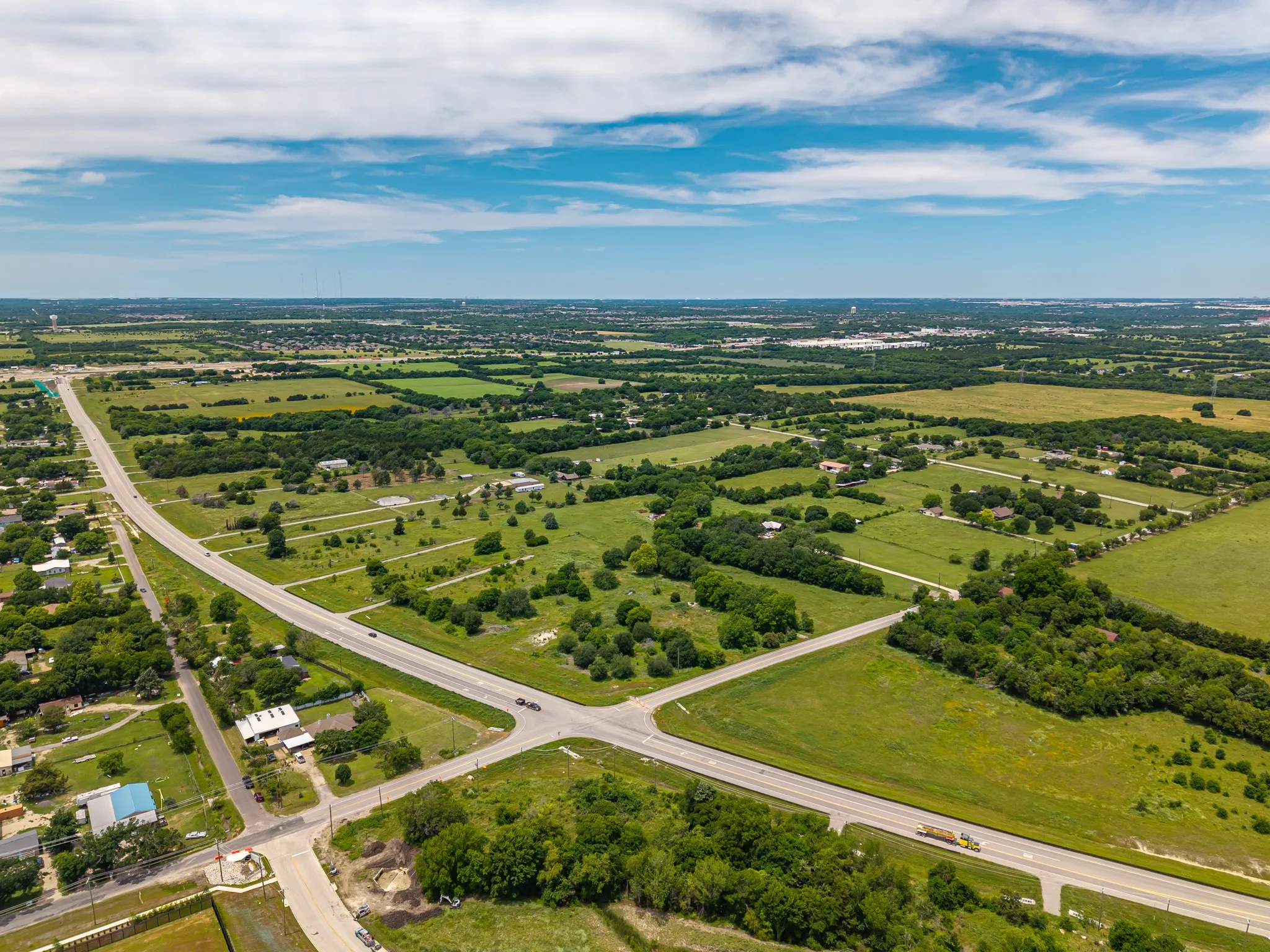 Expansive green acreage with established roads
