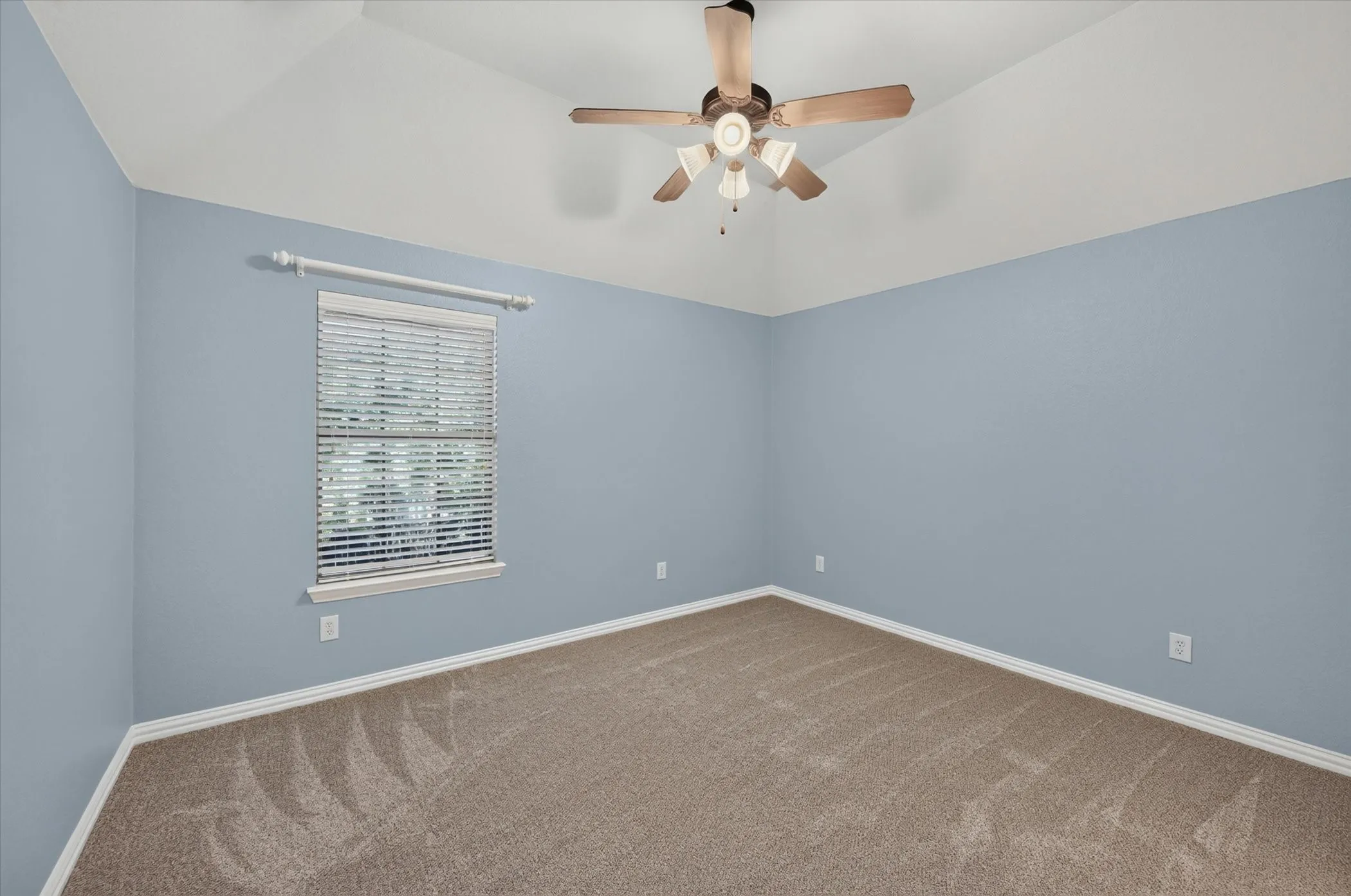 Cheerful west-facing upstairs bedroom overlooks the back yard