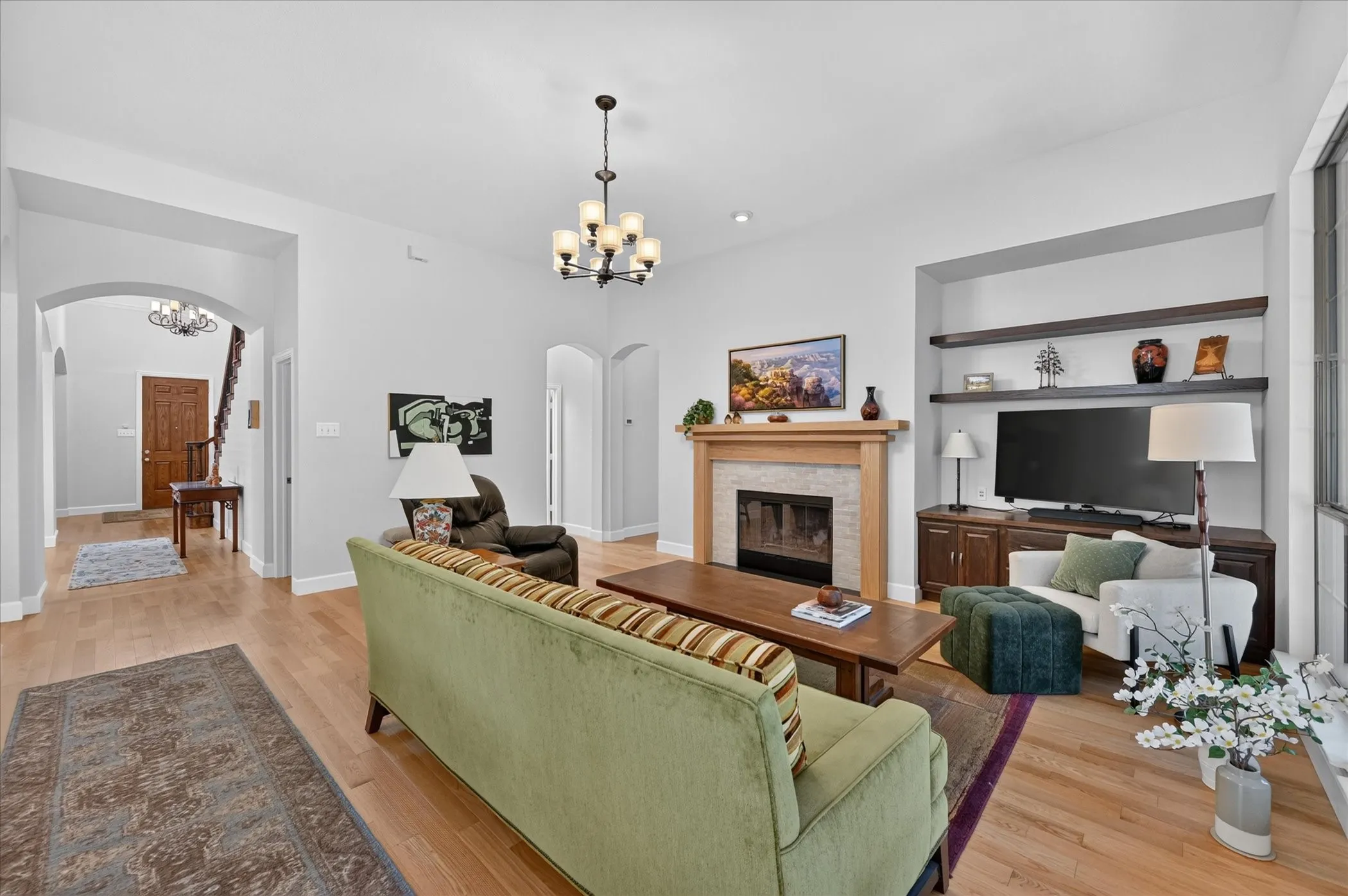 The fireplace features a custom made wooden mantle and gas starter