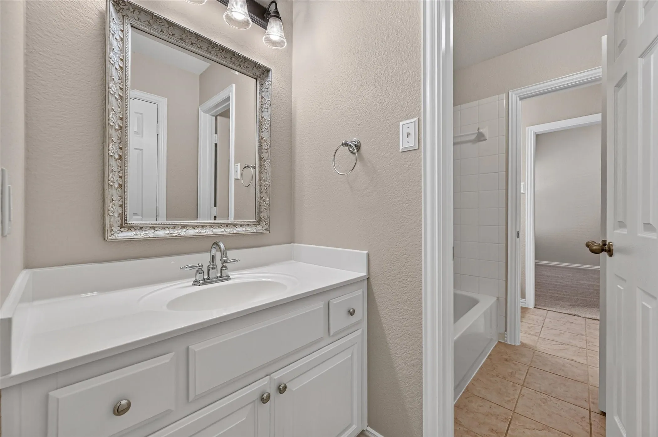 The Jack-and-Jill bath connects two other bedrooms