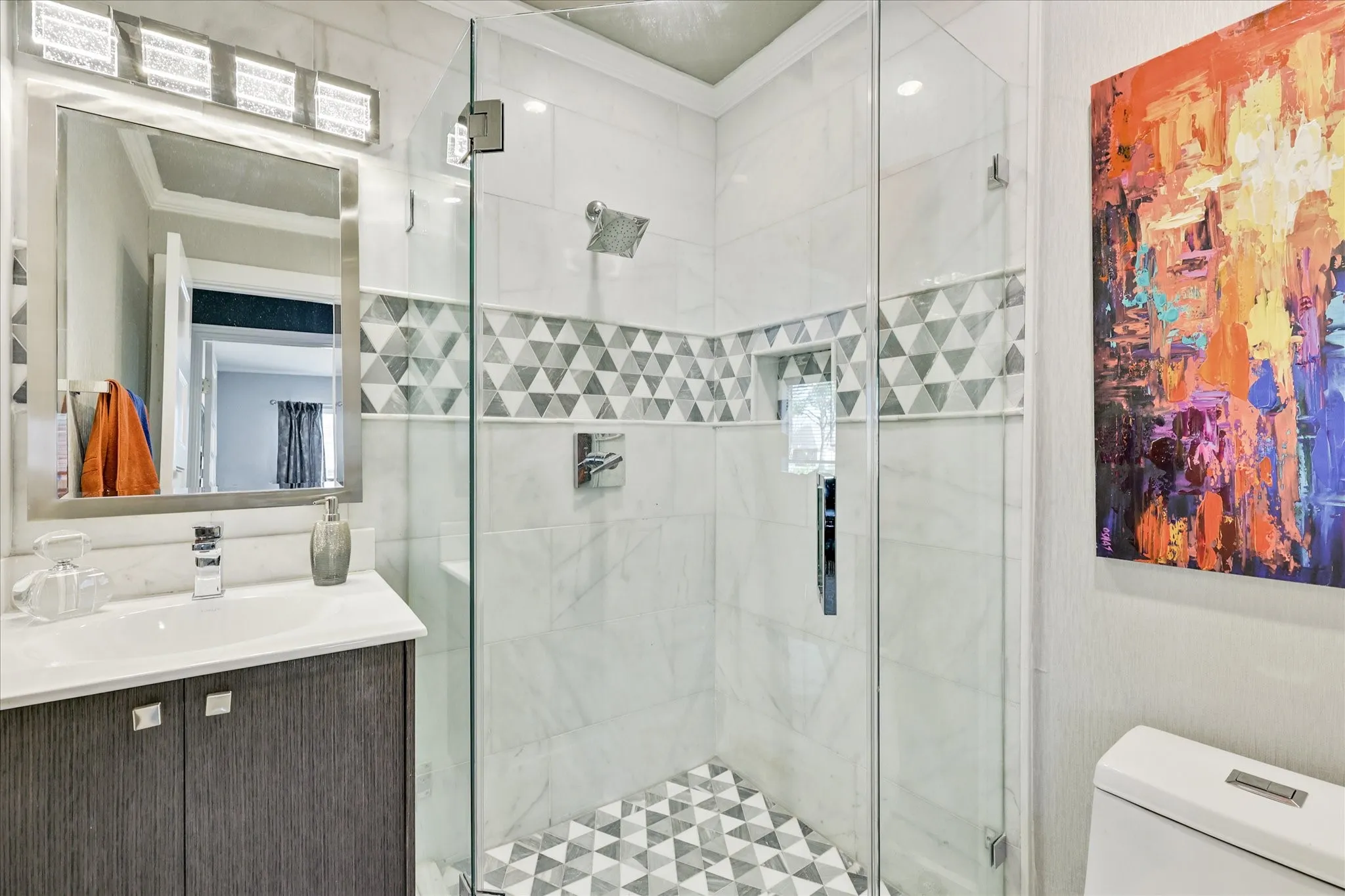 Recessed lighting, ceiling fan, two windows with blinds, and light-toned walls