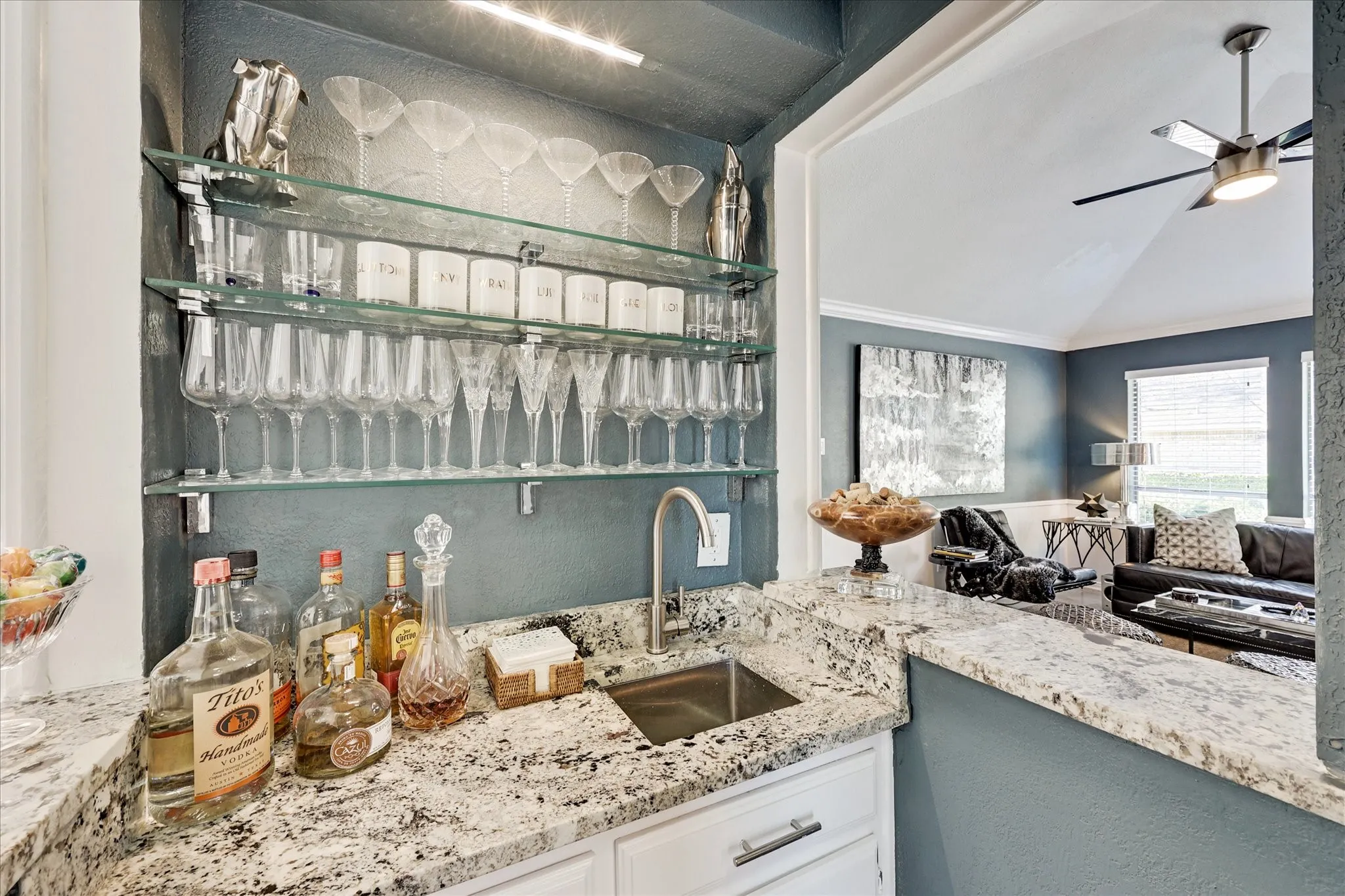 Recessed lighting, crown molding, ceiling fan, carpeted flooring, and sliding barn door with frosted glass panels