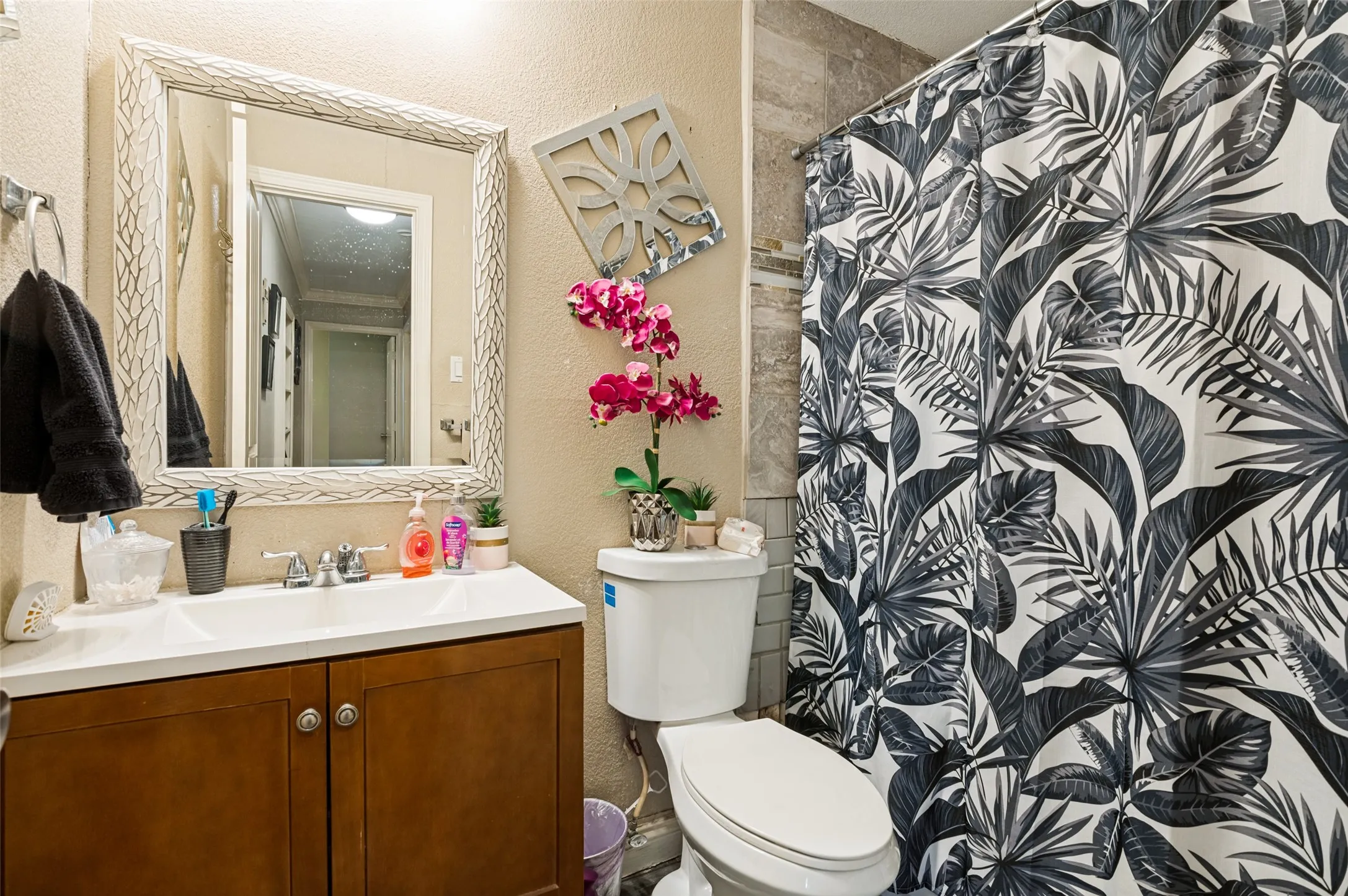 Shared hallway bathroom that needs some tile repair